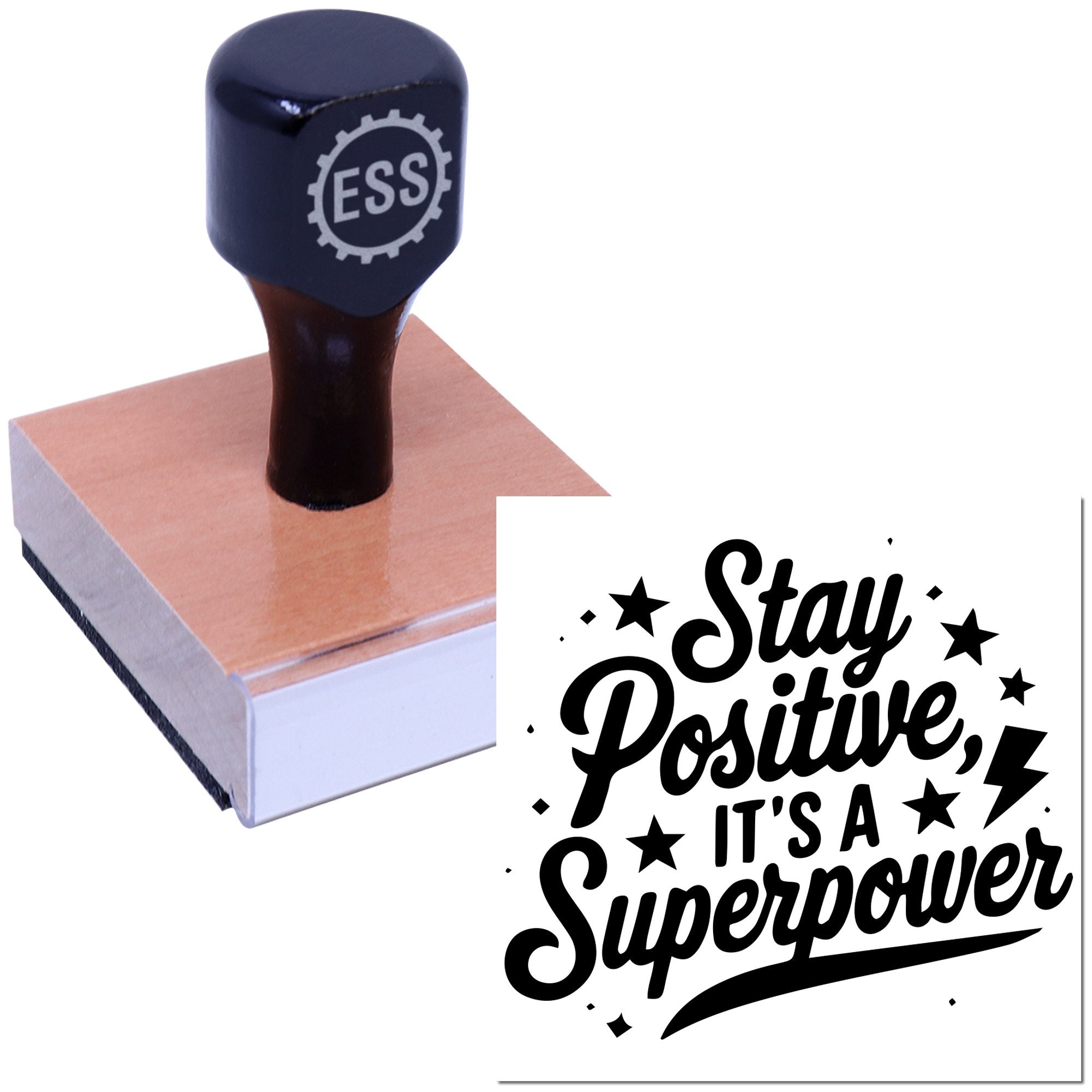 Black ESS rubber stamp on a pink seal pad, with a bold Stay Positive, Its a Superpower imprint.