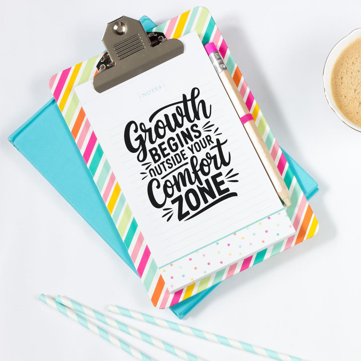 Colorful striped clipboard with stamped note, pencil, and turquoise notebook; stamp and seal stationery set.