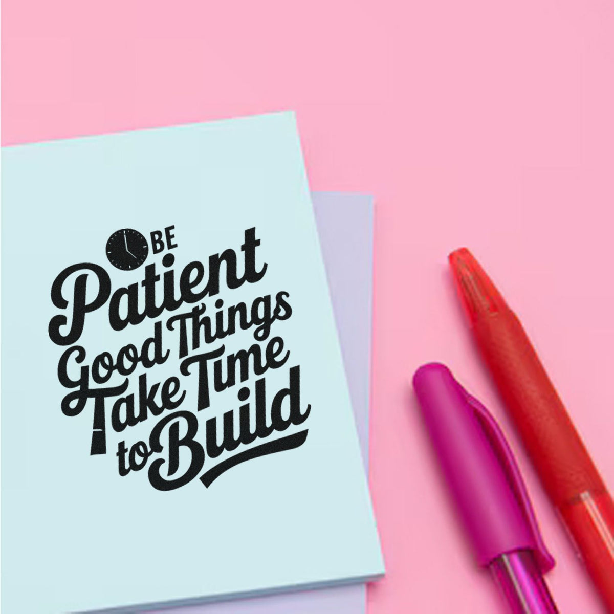 Custom stamp and seal products: black lettering on light blue paper, with red and purple handles on a pink background.