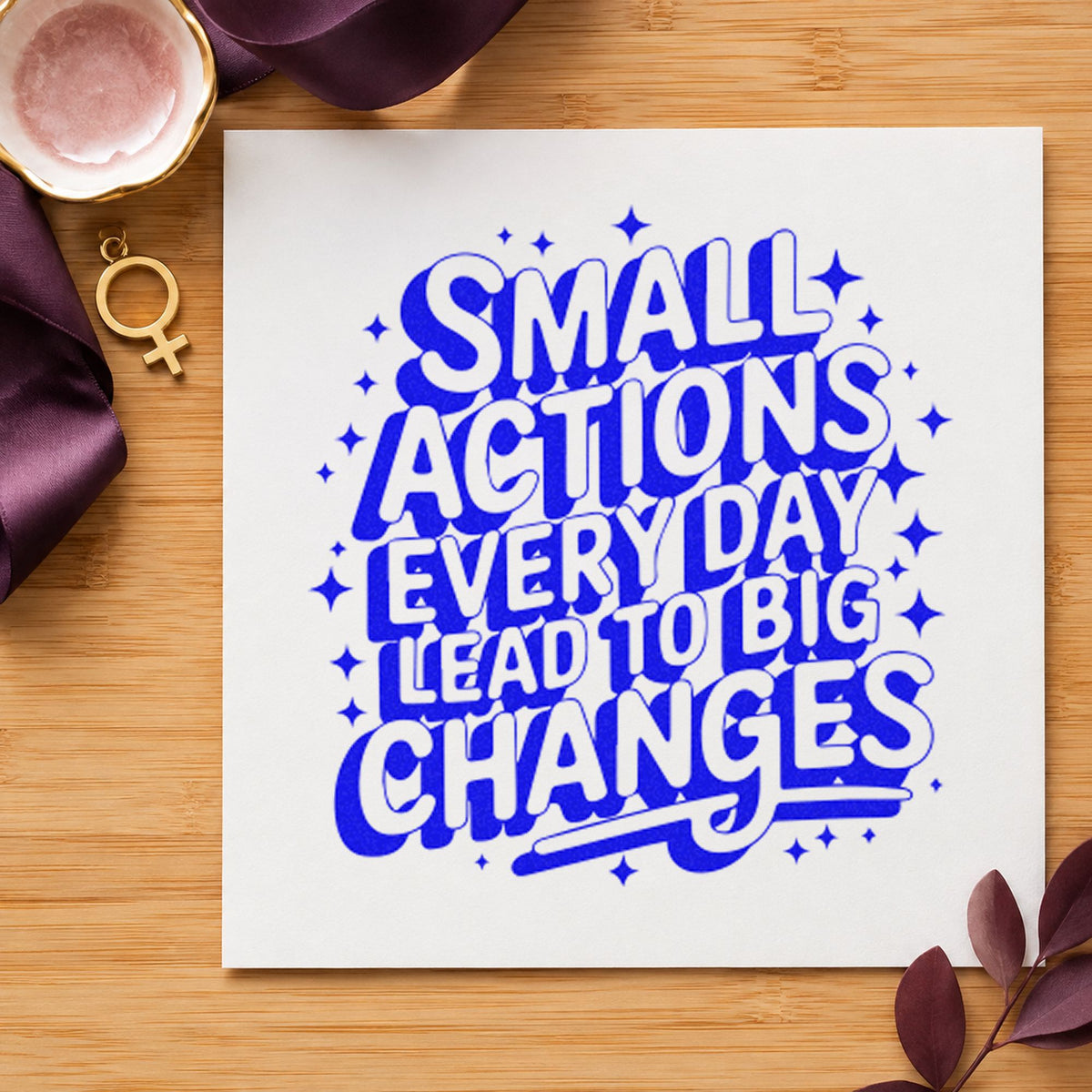 Small Actions Big Changes craft stamp in blue ink on cardstock, an easy option for camera strap printing.