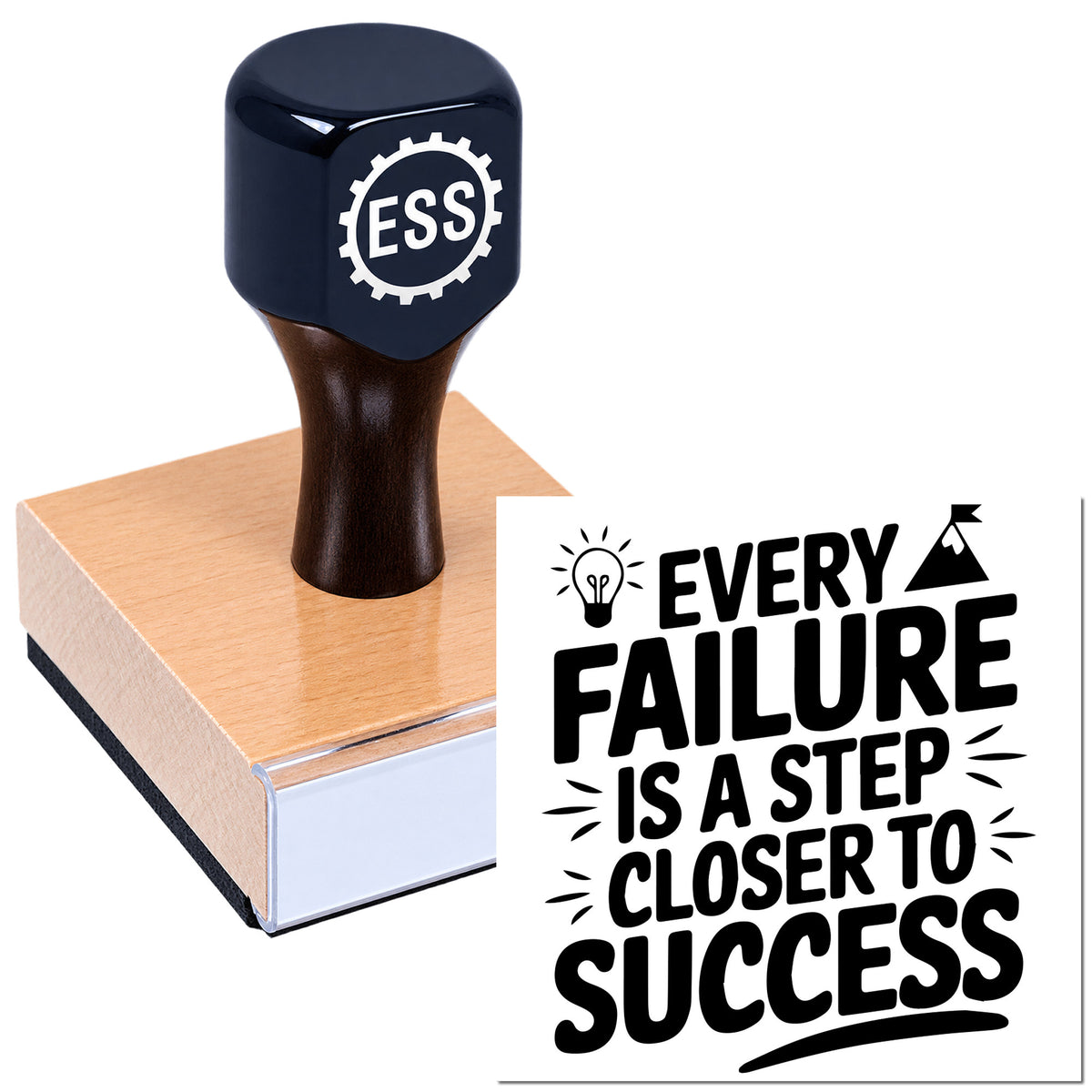 Black ESSS stamp and seal on pink wood block, showing "Every failure is a step closer to success" design.