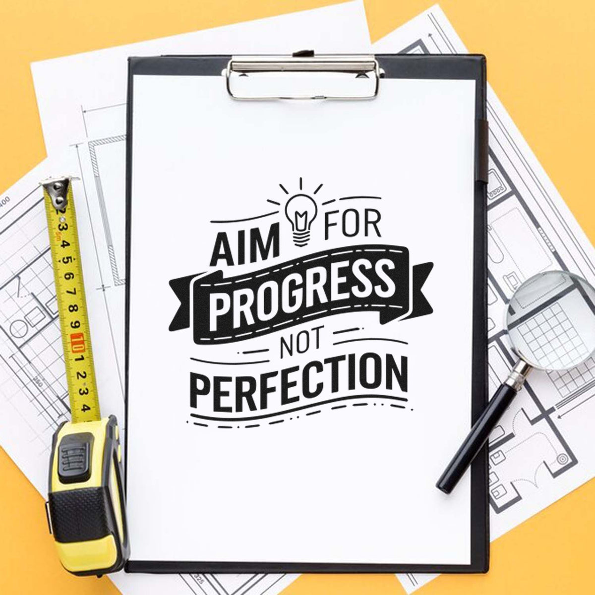 Black-and-white motivational stamp on clipboard with tape measure and blueprints on yellow background for stamp and seal products.