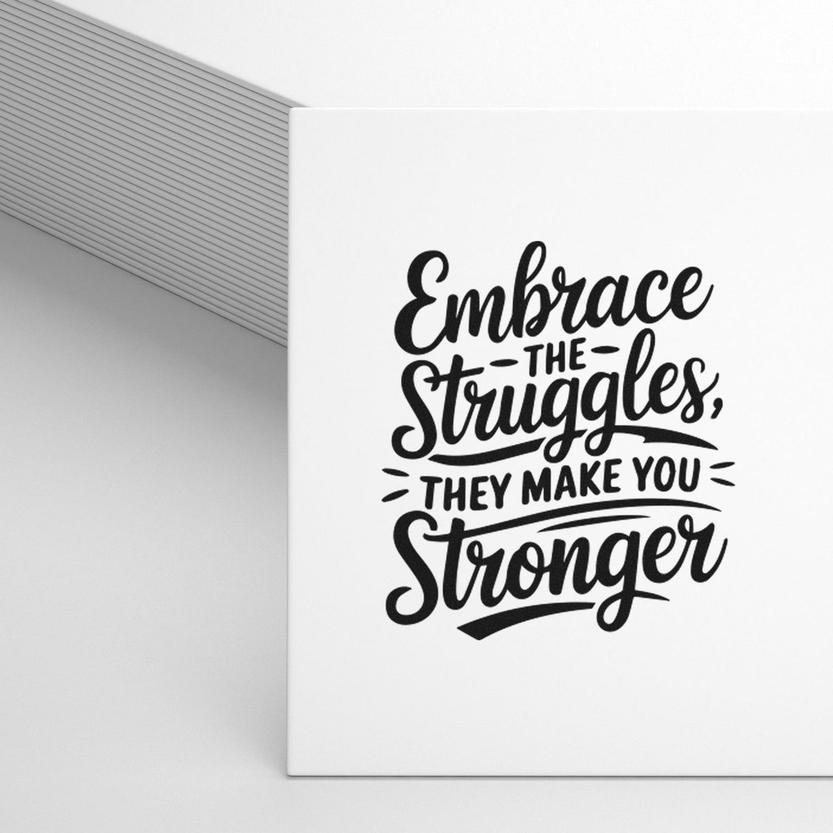 Custom stamp and seal with black motivational quote on white background, beside gray striped packaging.