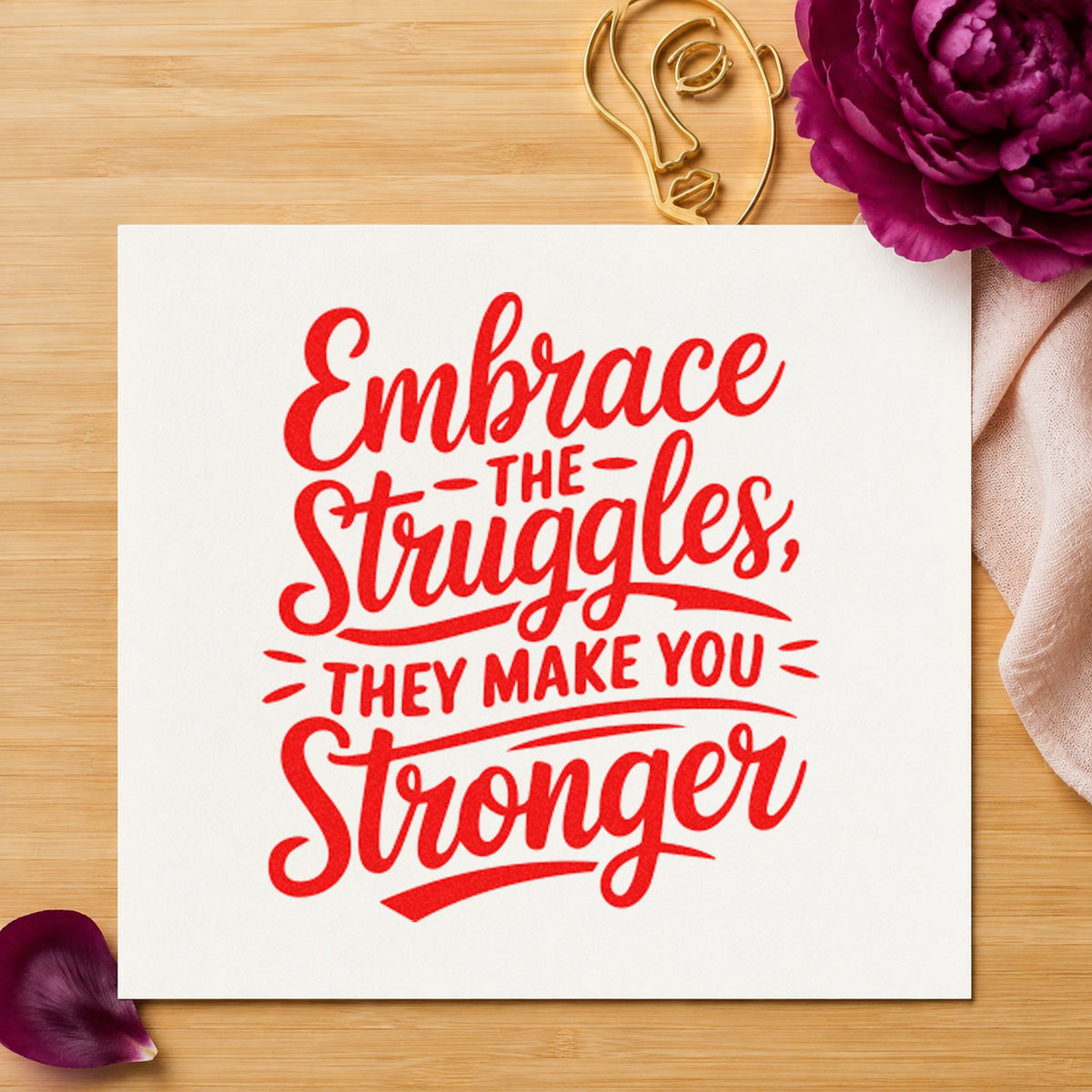 Embrace Struggles Make Stronger craft stamp imprint in red ink on a handmade project, one idea being case brief cards.