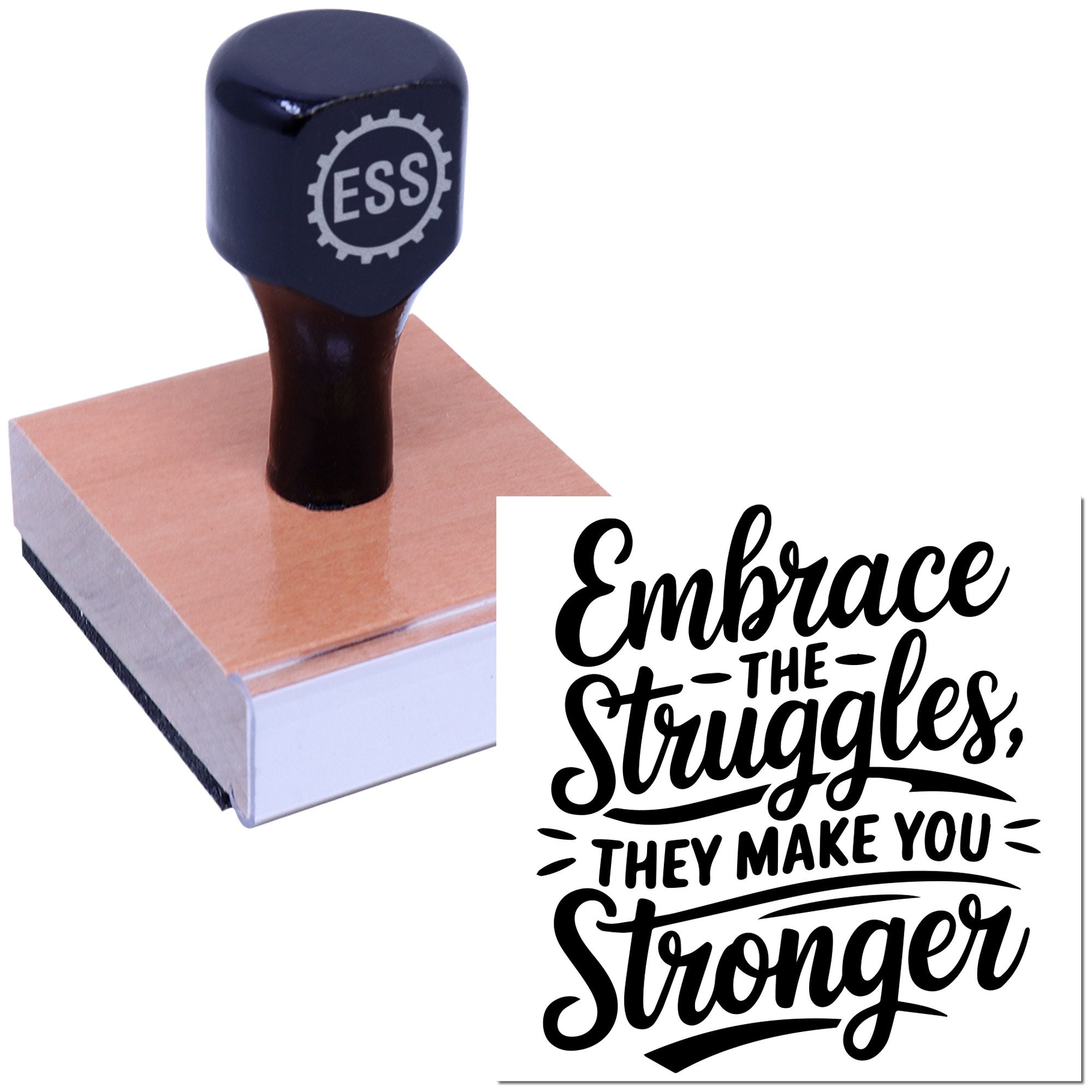 Navy and black rubber stamp with ESS gear logo beside a wooden seal block and bold motivational quote.