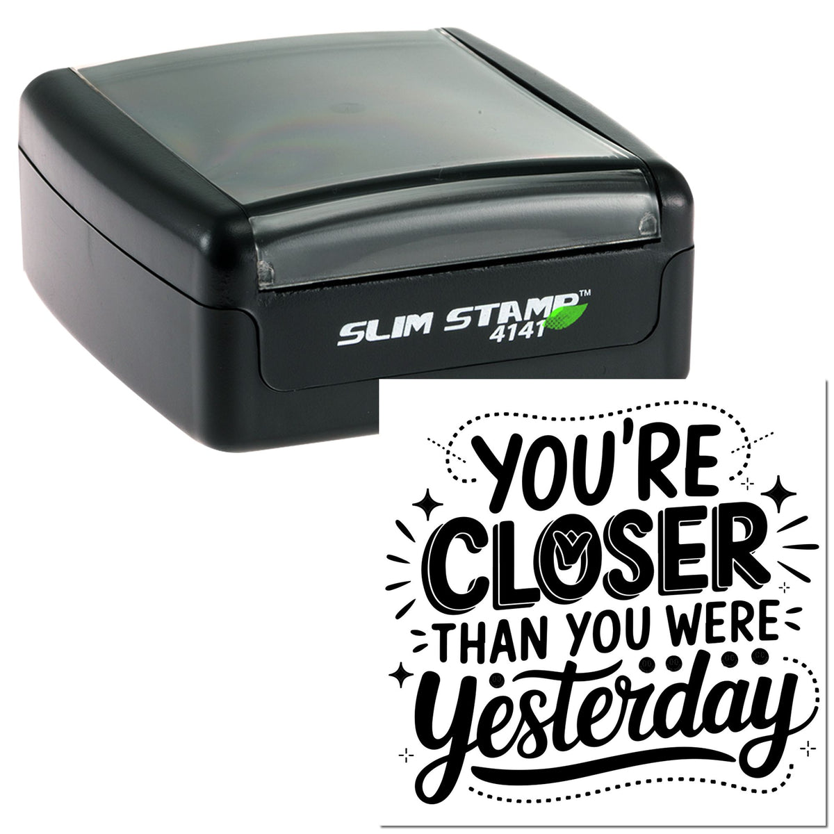 Black self-inking Slim Stamp 4141 with translucent gray lid and custom seal reading Youre closer than you were yesterday.