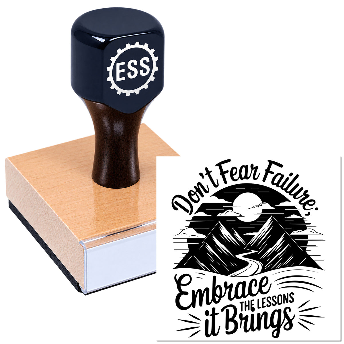 Black ESS rubber stamp on a pink wooden base beside a black-and-white mountain seal design reading "Don't Fear Failure"