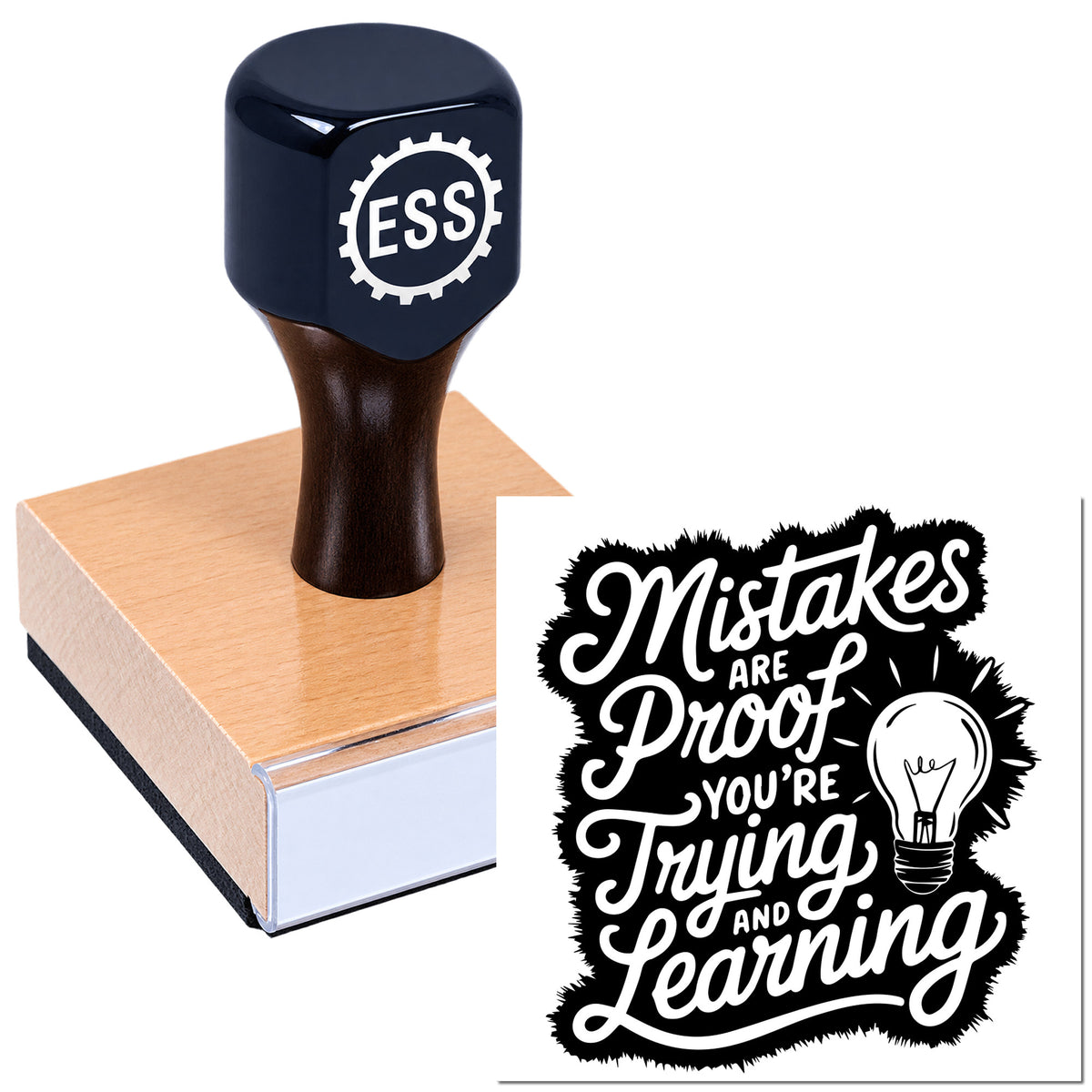 Navy ESS rubber stamp on wooden block beside black-and-white seal reading "Mistakes are proof you're trying and learning."