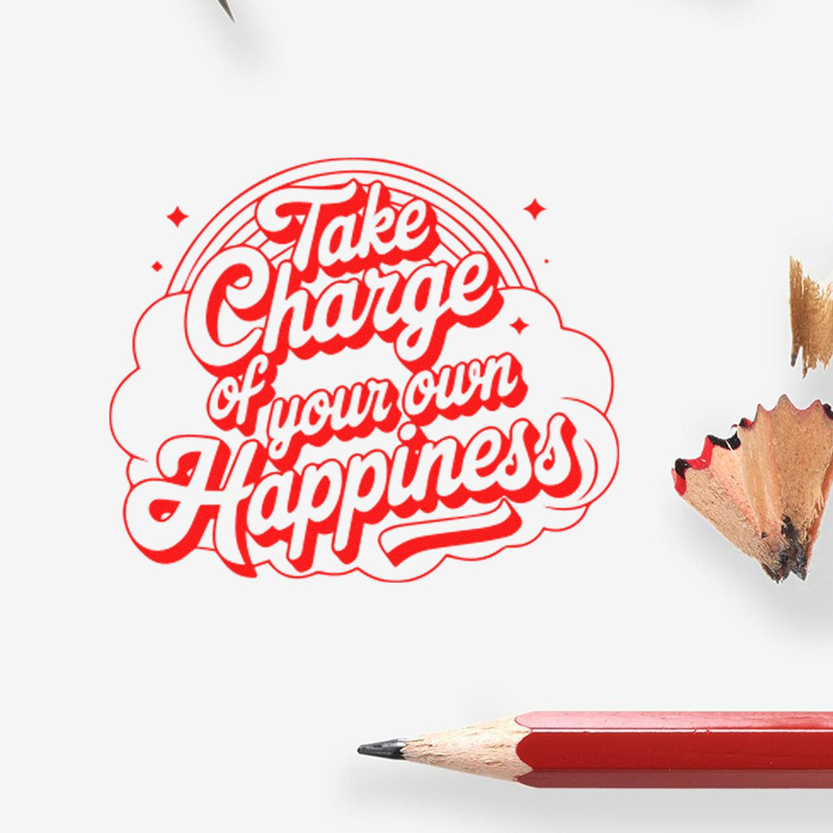 Red rubber stamp seal reading Take Charge of your own Happiness on white, with red pencil and wood shavings.