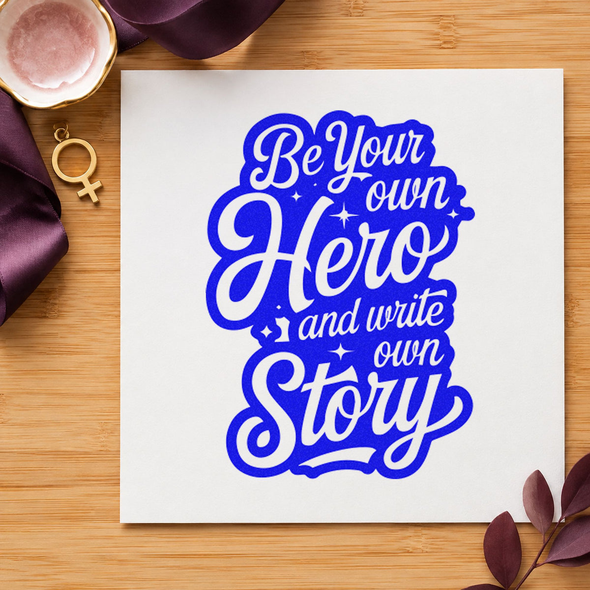 Own Hero Own Story craft stamp in blue ink on cardstock, an easy option for table cloth printing.
