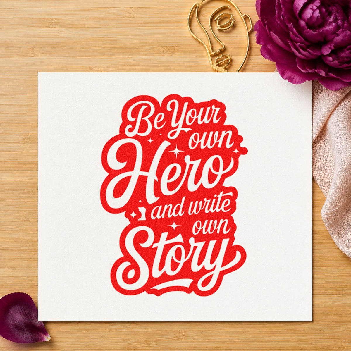 Own Hero Own Story craft stamp imprint in red ink on a handmade project, one idea being character note cards.