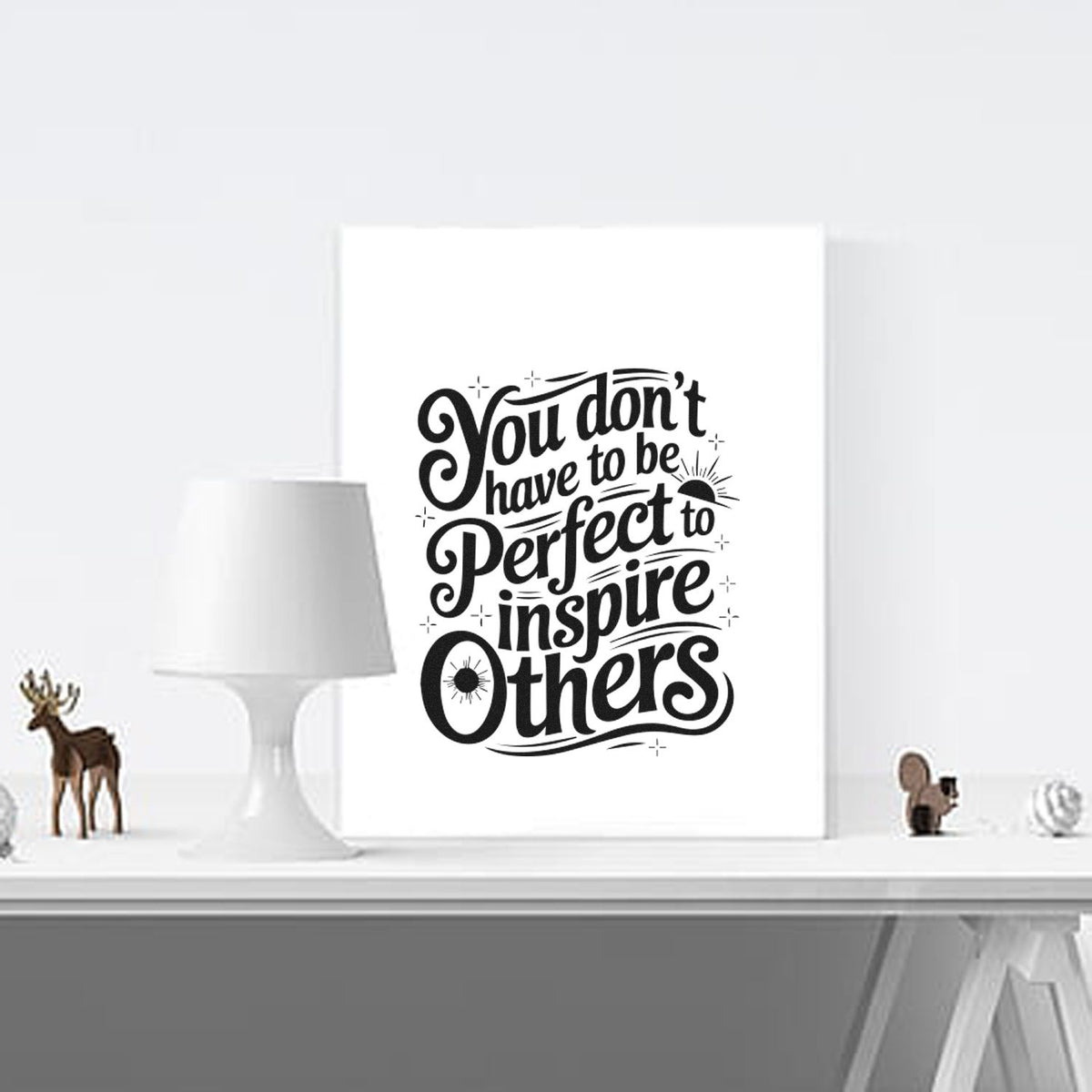 Black decorative stamp and seal design with You dont have to be perfect to inspire others on a white canvas.