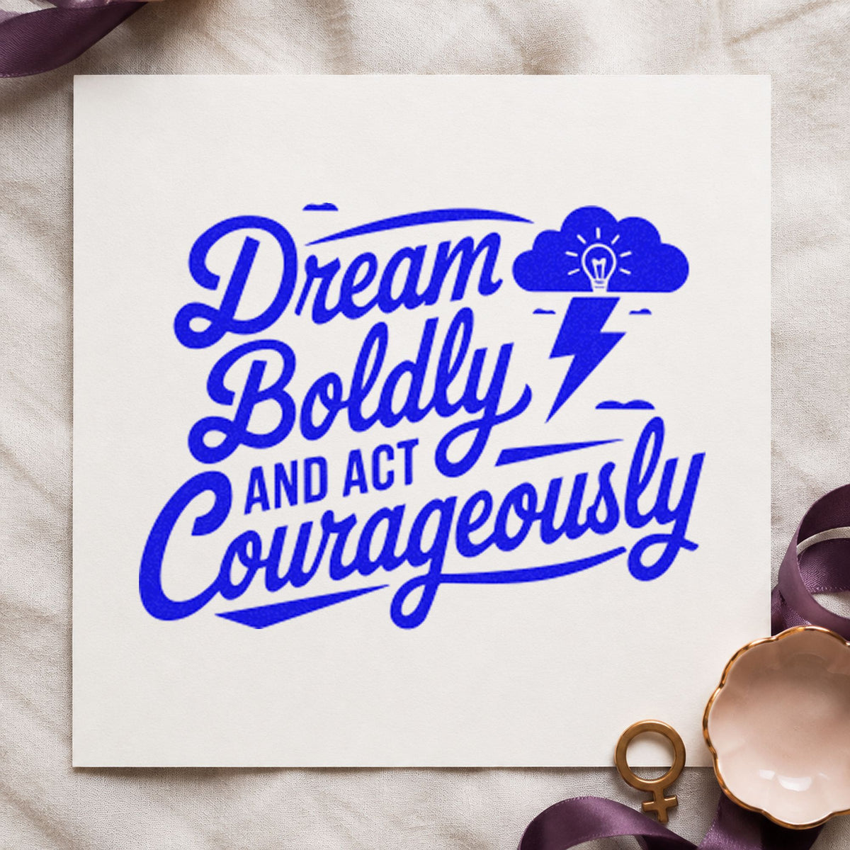 Dream Boldly Act Courageously craft stamp imprinted in blue ink on paper, a design suited to framed club room.
