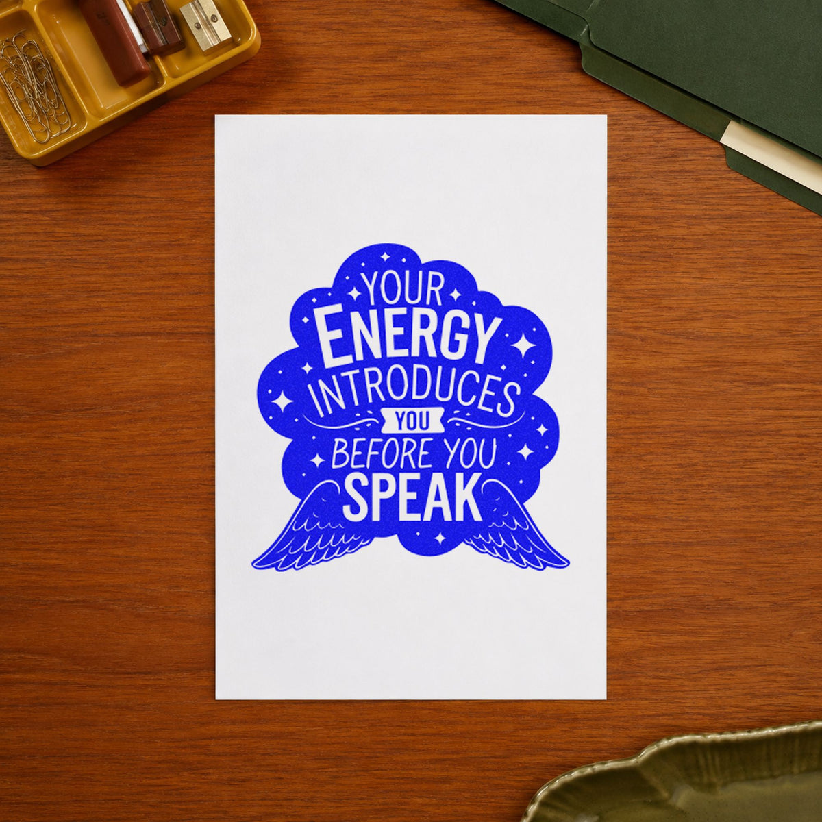 Energy Introduces Before Speak craft stamp imprinted in blue ink on paper, a design suited to framed home studio.