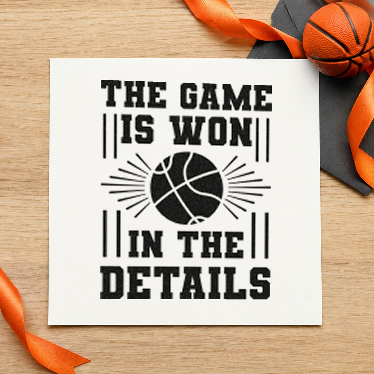 Game Won In Details craft stamp imprint in black ink on a handmade project, one idea being practice plan headers.
