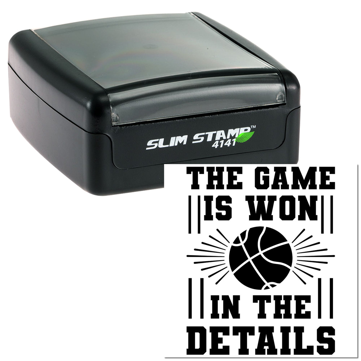 Black self-inking stamp with gray translucent cap, showing a basketball seal design and bold THE GAME IS WON! text.