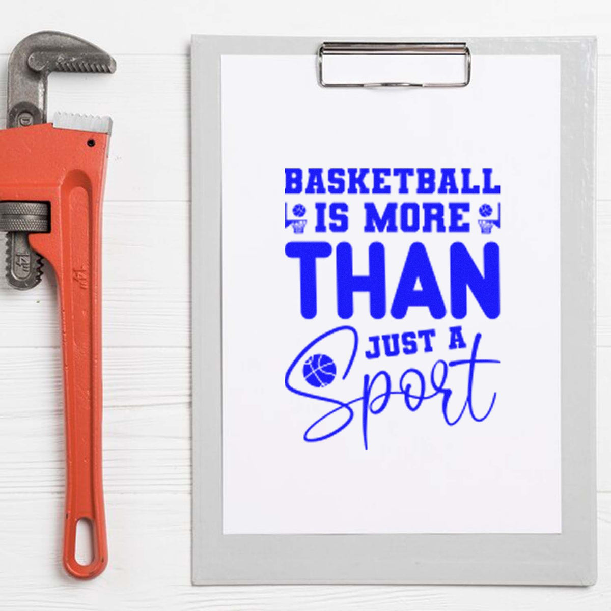 Blue basketball slogan rubber stamp on clipboard beside red seal tool and pipe wrench