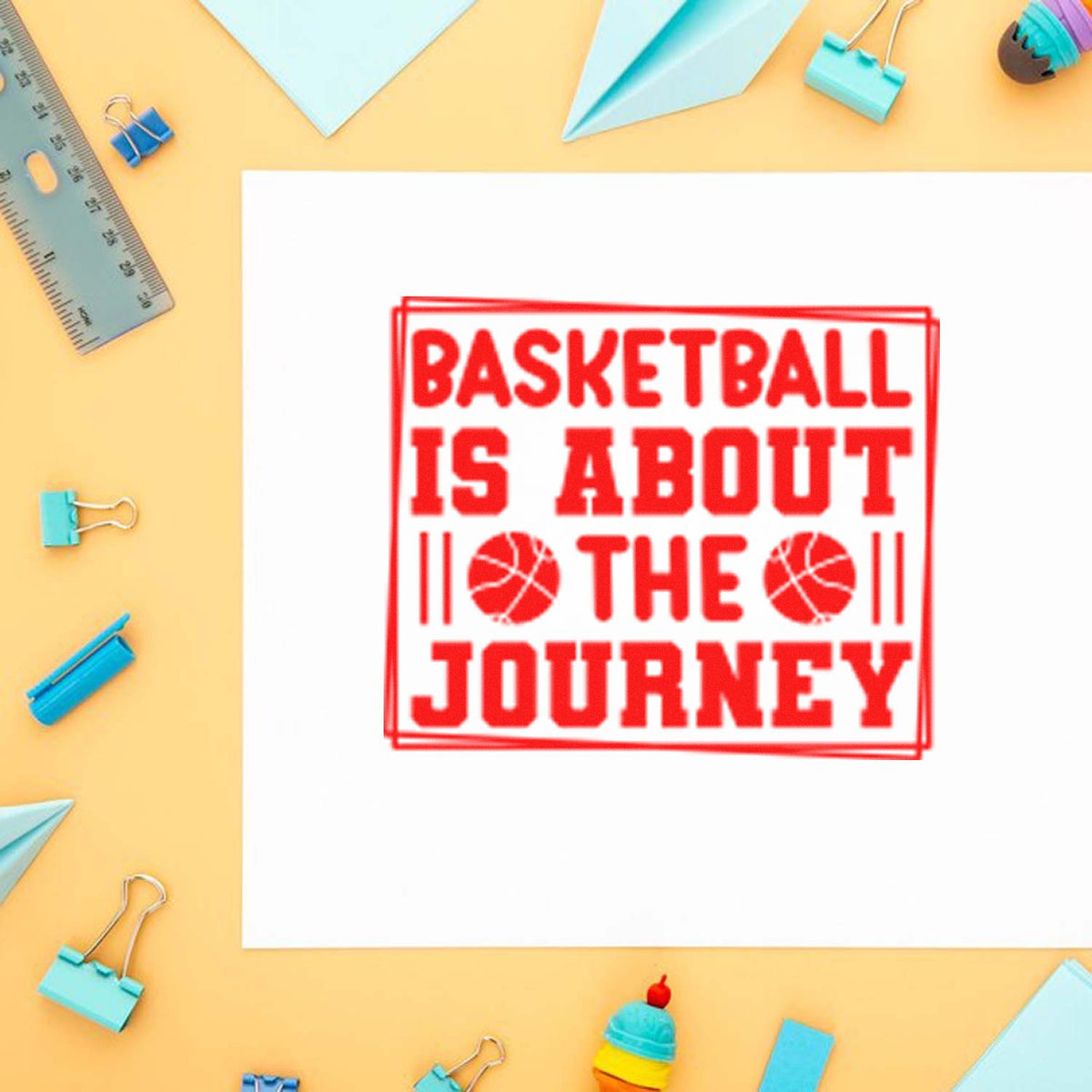 Red basketball stamp and seal on white paper reading Basketball is about the journey, with pastel stationery around it.