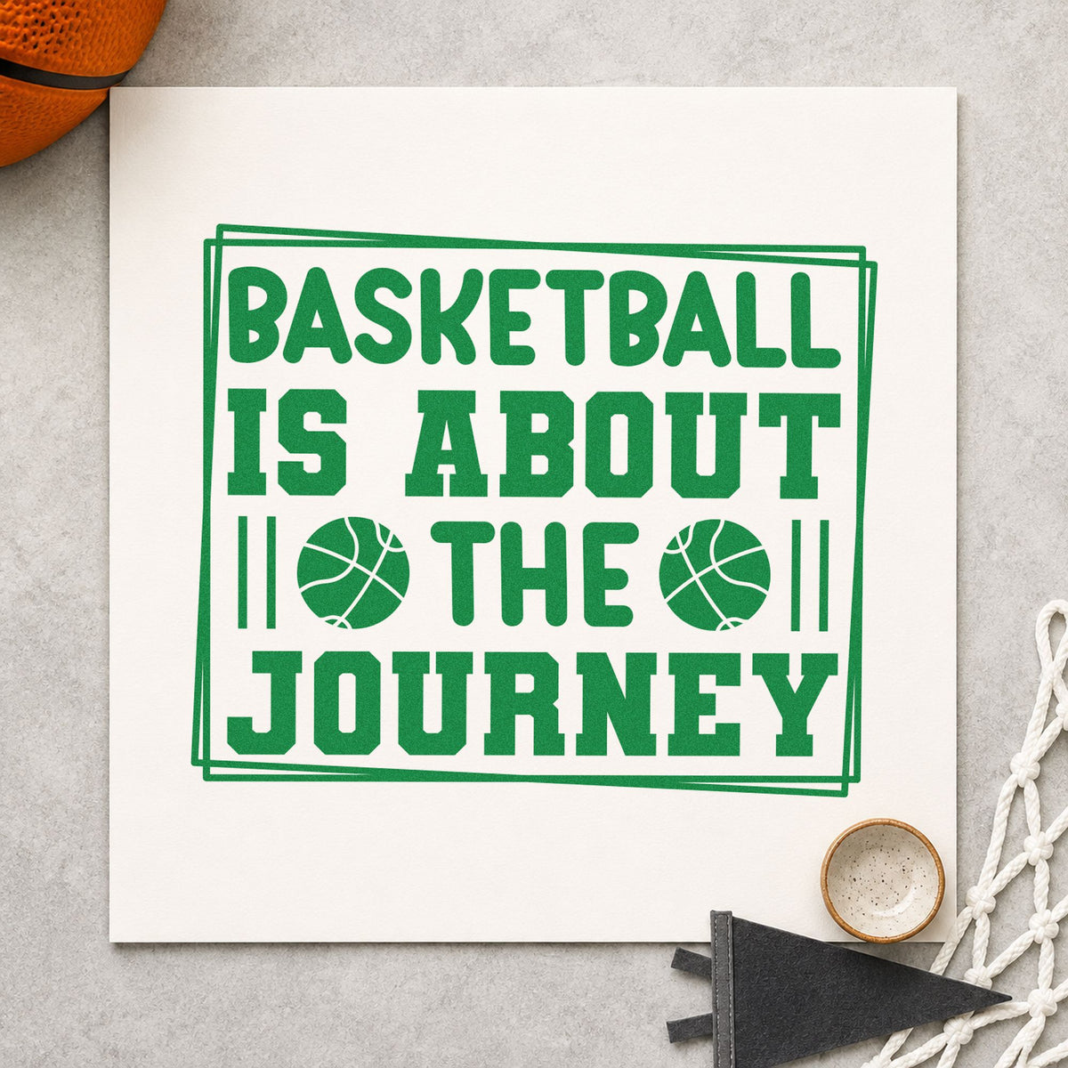 Basketball About The Journey craft stamp imprint in green ink on a handmade project, one idea being memory slip cards.