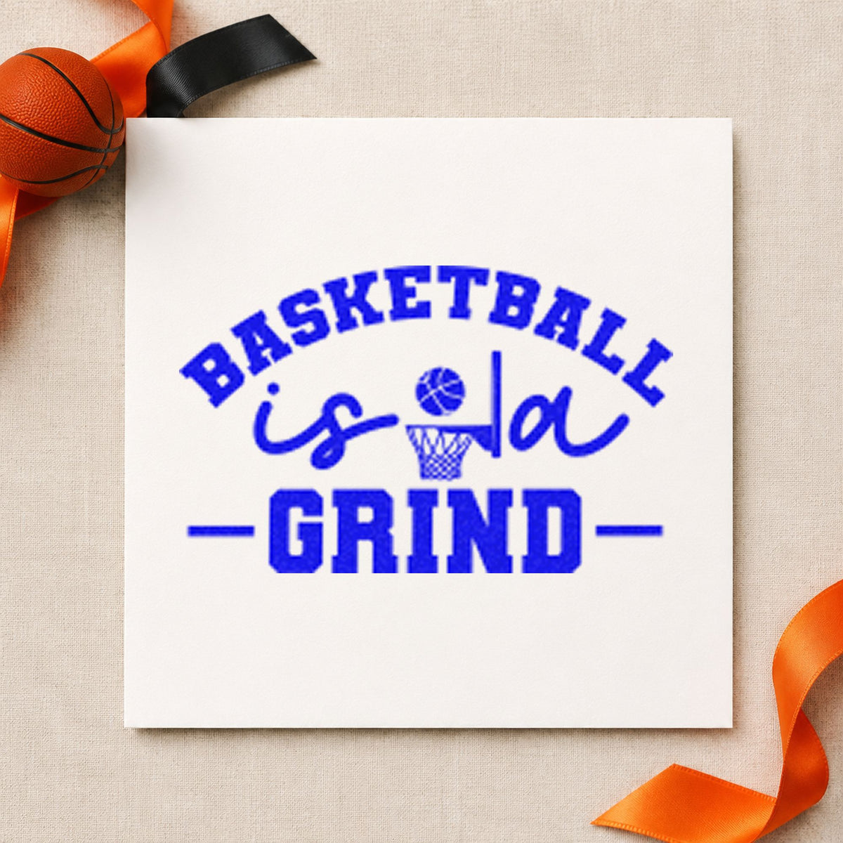Basketball Is A Grind craft stamp in blue ink on cardstock, an easy option for shooting sleeve printing.