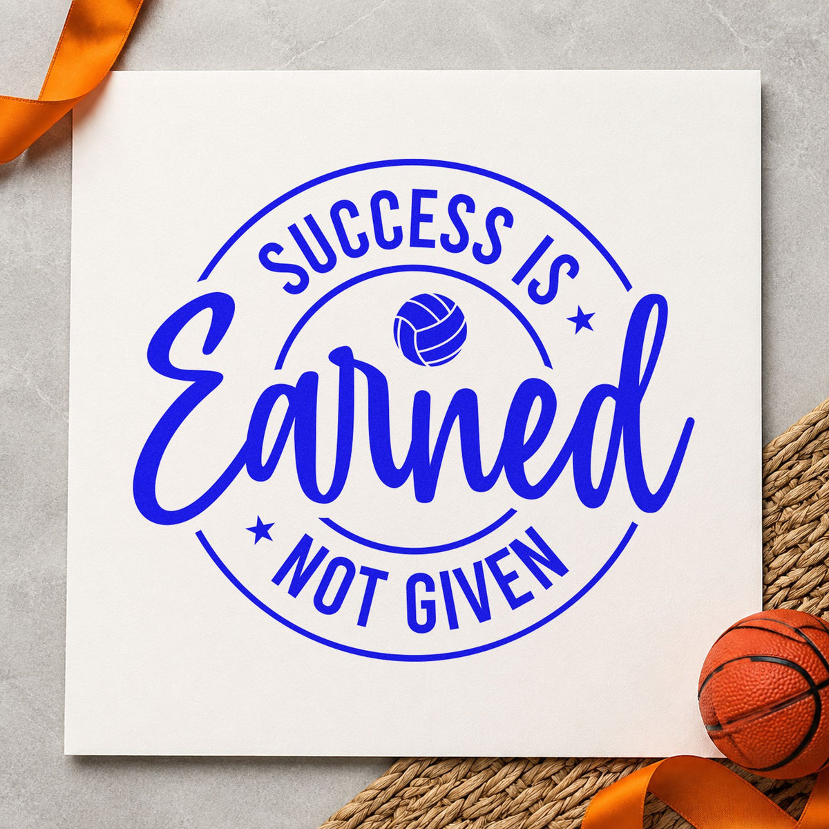 Success Earned Circular Badge craft stamp in blue ink on cardstock, an easy option for warmup tee printing.