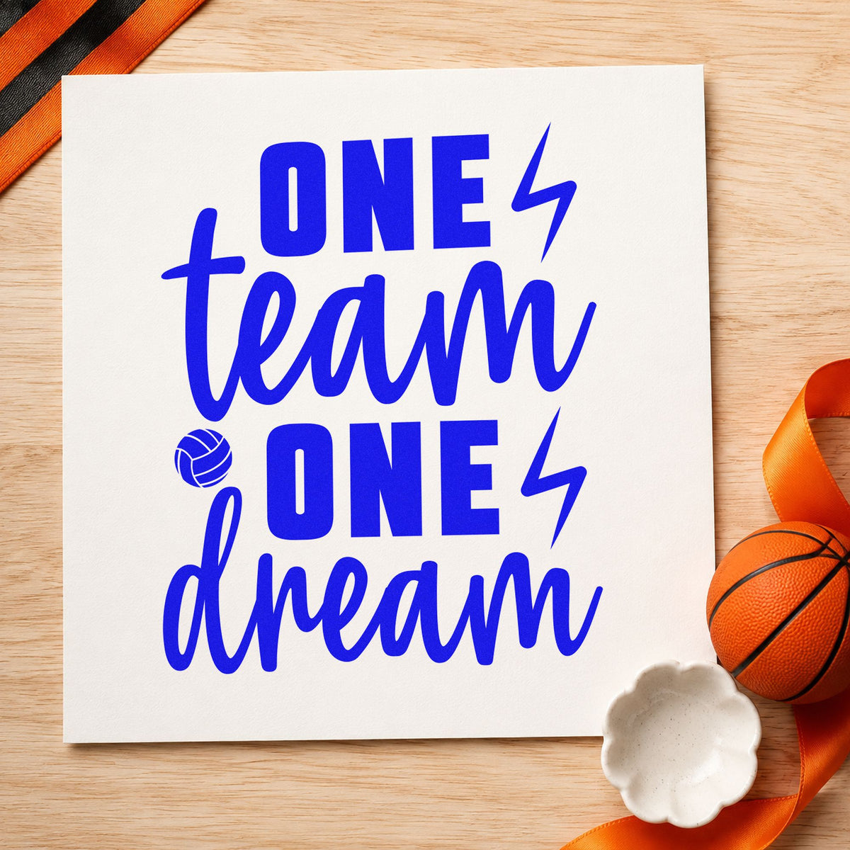 One Team One Dream craft stamp in blue ink on cardstock, an easy option for team shirt printing.