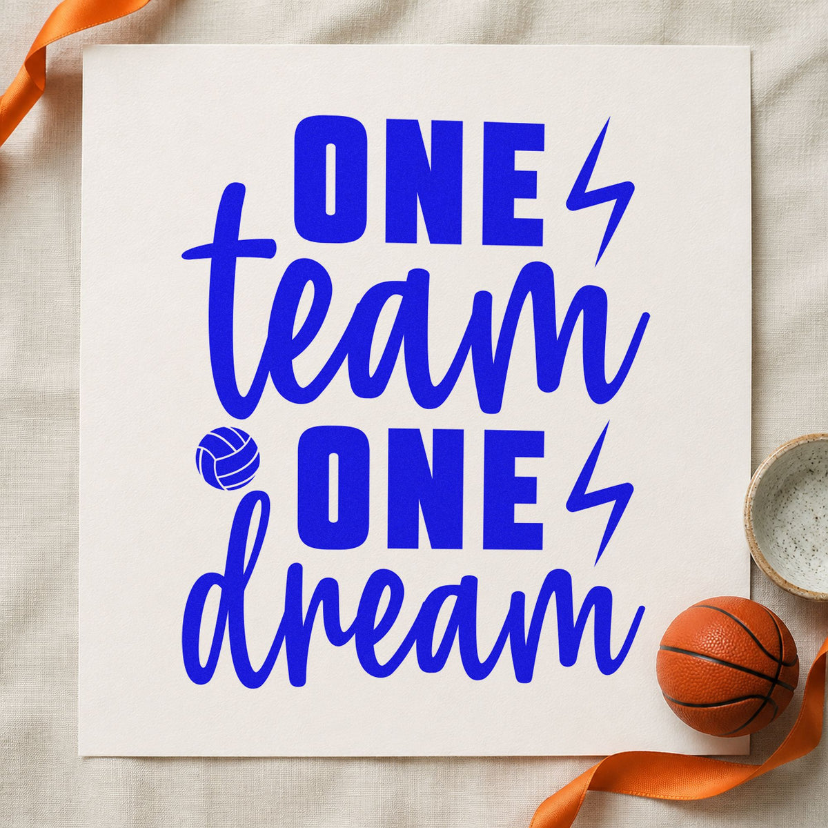 One Team One Dream craft stamp imprinted in blue ink on paper, a design suited to framed office corner.