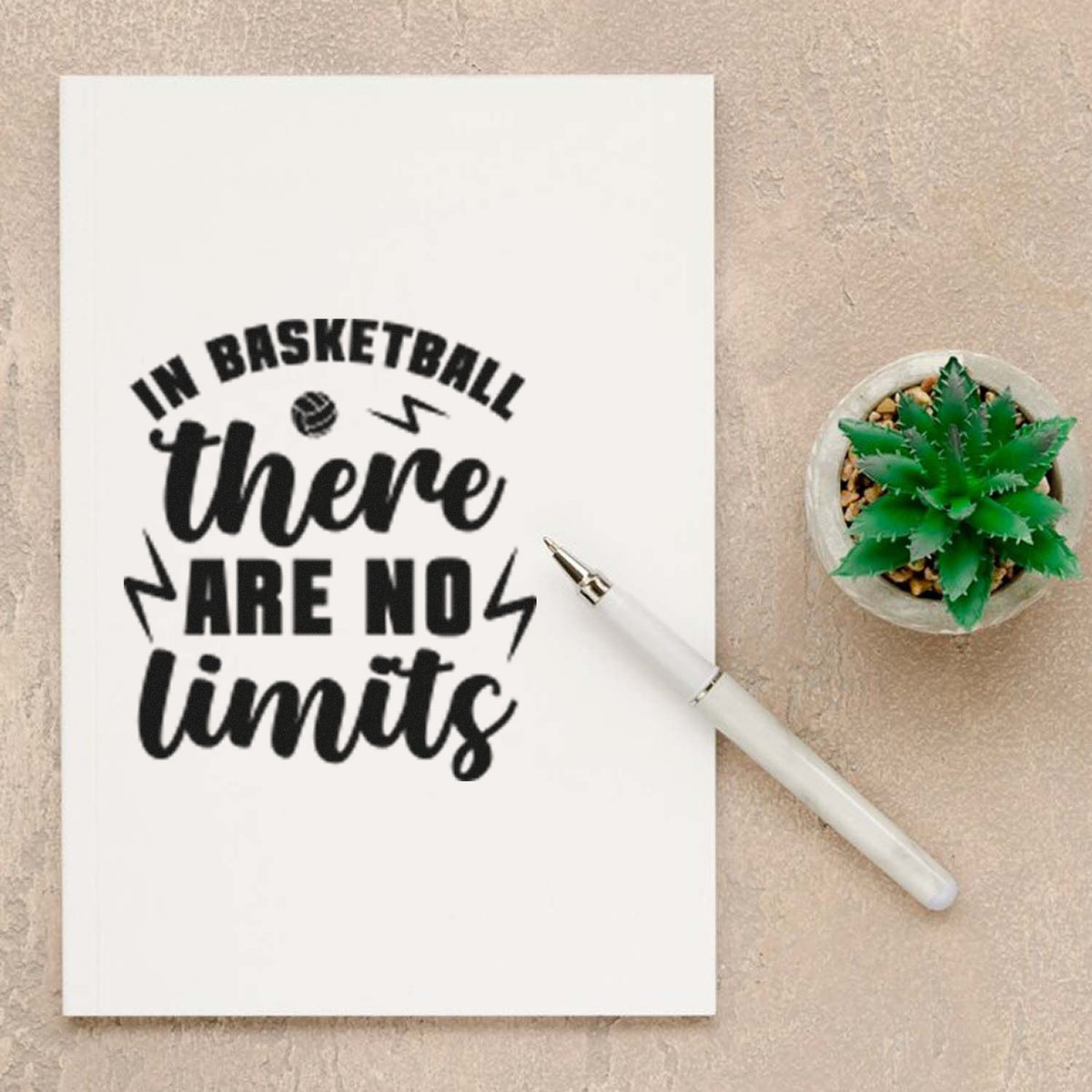 Black basketball quote custom stamp and seal on white card, with white pen and green succulent.