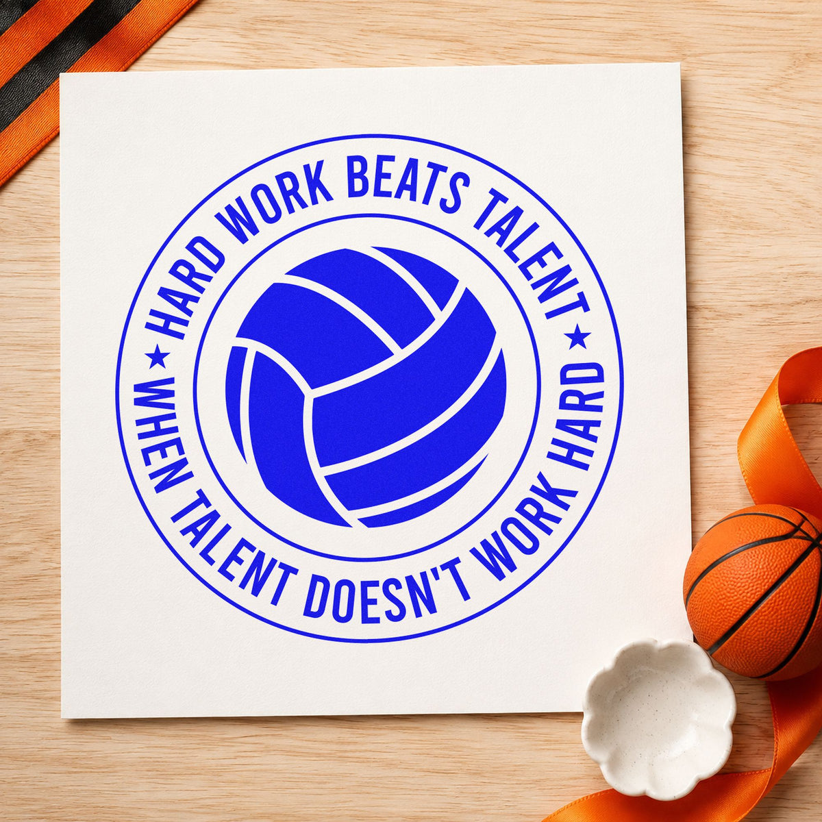 Hard Work Beats Talent craft stamp imprinted in blue ink on paper, a design suited to framed practice court.
