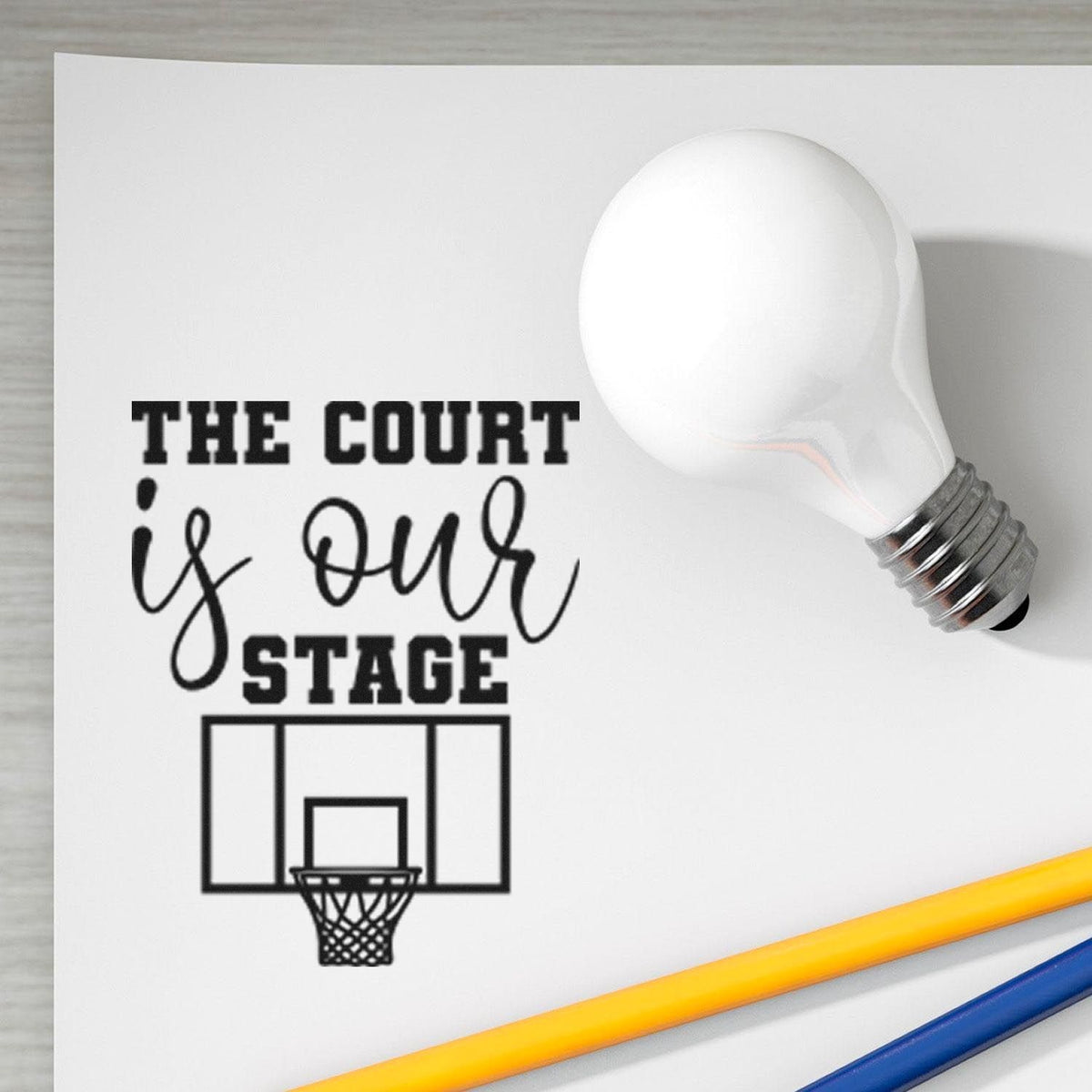 Custom stamp and seal with black The Court is Our Stage text, basketball hoop graphic, and white light bulb.
