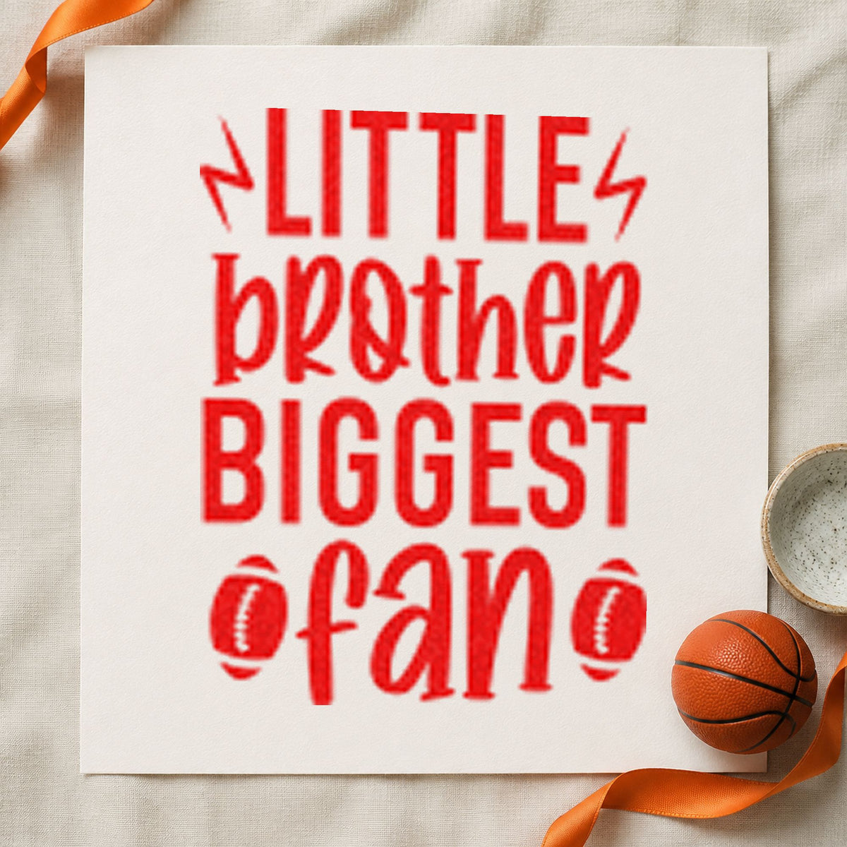 Little Brother Biggest Fan craft stamp imprint in red ink on a handmade project, one idea being cheer word cards.