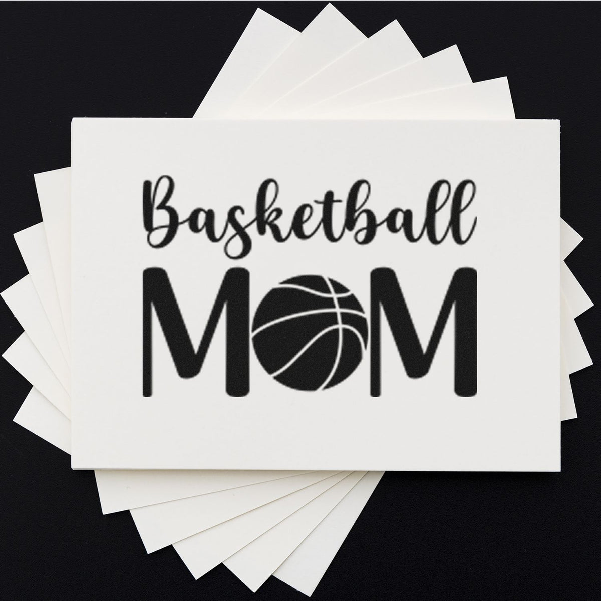 White custom stamp and seal sheets featuring black Basketball Mom text and basketball icon on a black background.