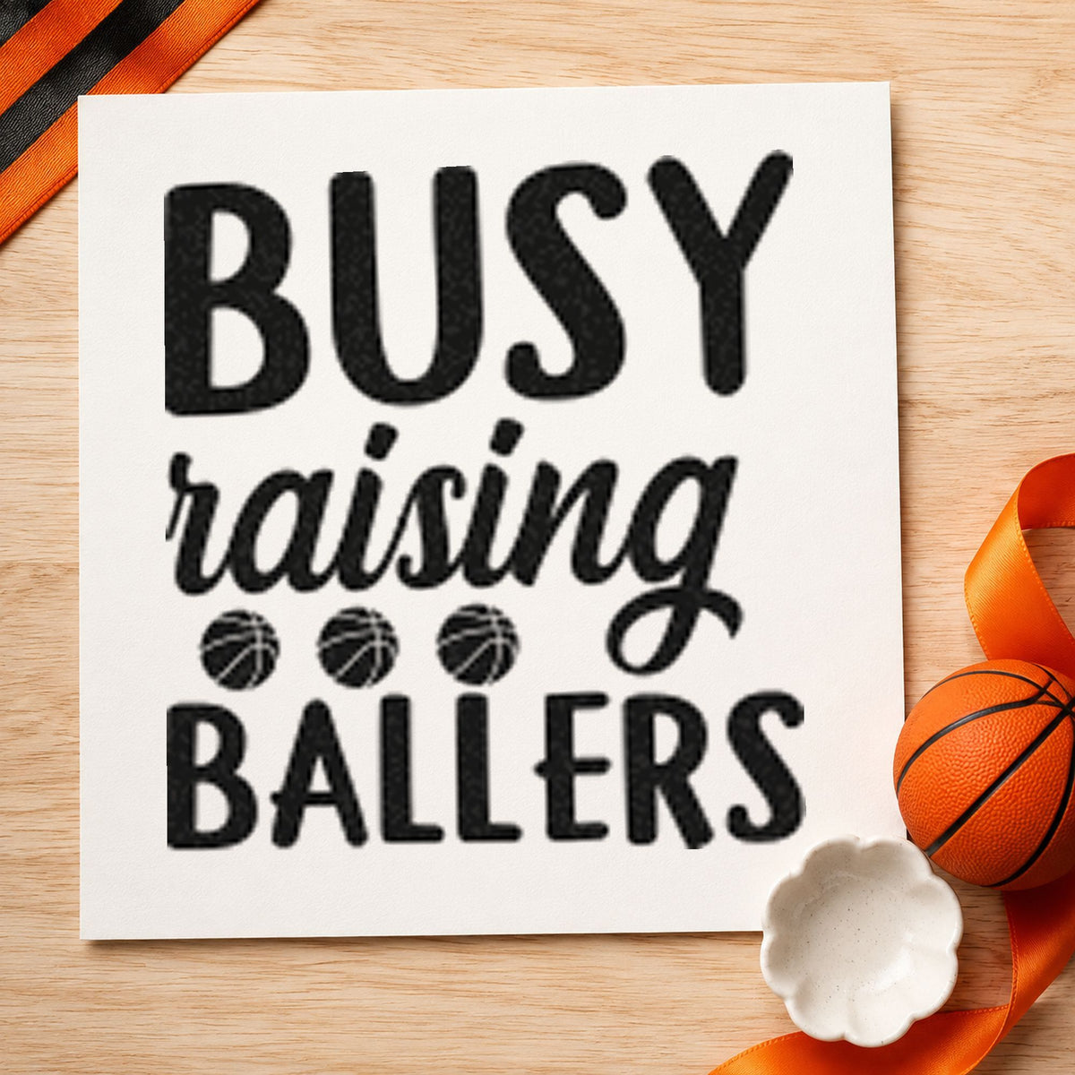 Busy Raising Ballers Quote craft stamp imprint in black ink on a handmade project, one idea being bag sort gift tags.