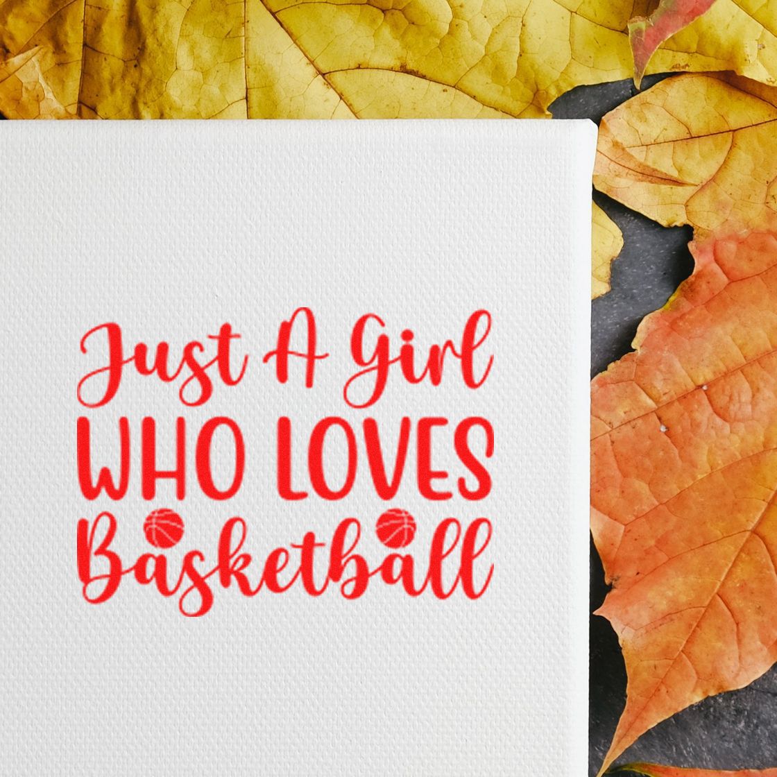 Red Just a girl who loves basketball stamp on white textured card, framed by yellow and orange autumn leaves.