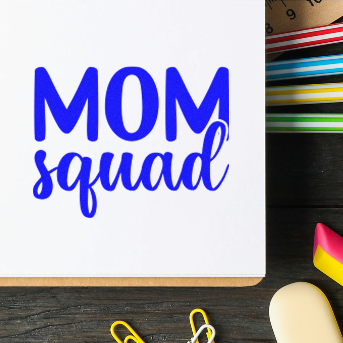 Blue MOM squad stamp on white card with colorful stamp and seal tape swatches