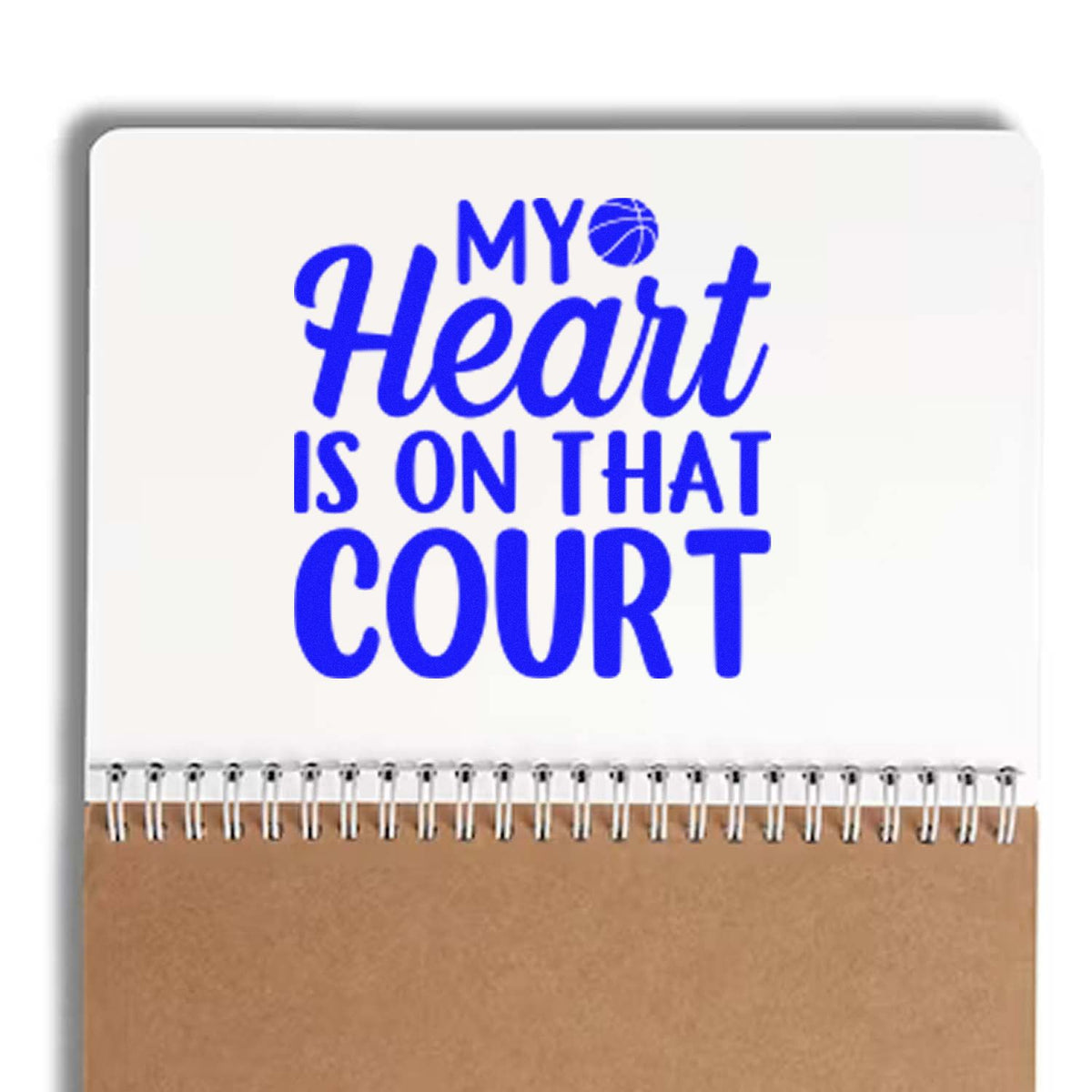 Blue My Heart Is On That Court basketball stamp seal on white notebook-style pad with brown bottom and spiral binding.