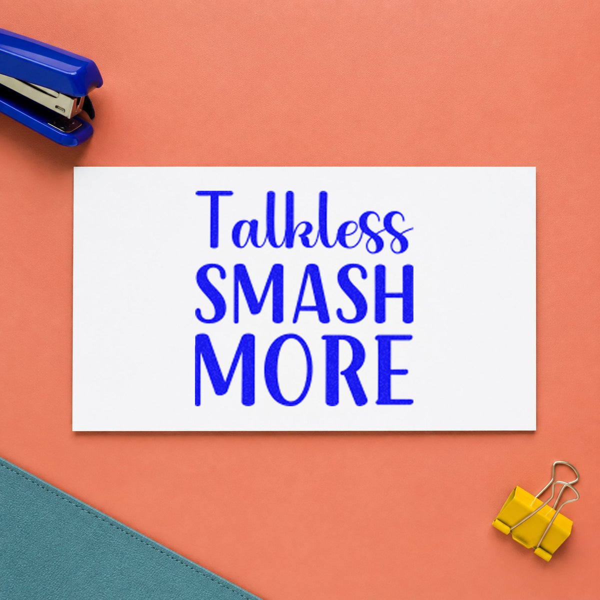 Talk Less Smash More craft stamp in blue ink on cardstock, an easy option for practice top printing.