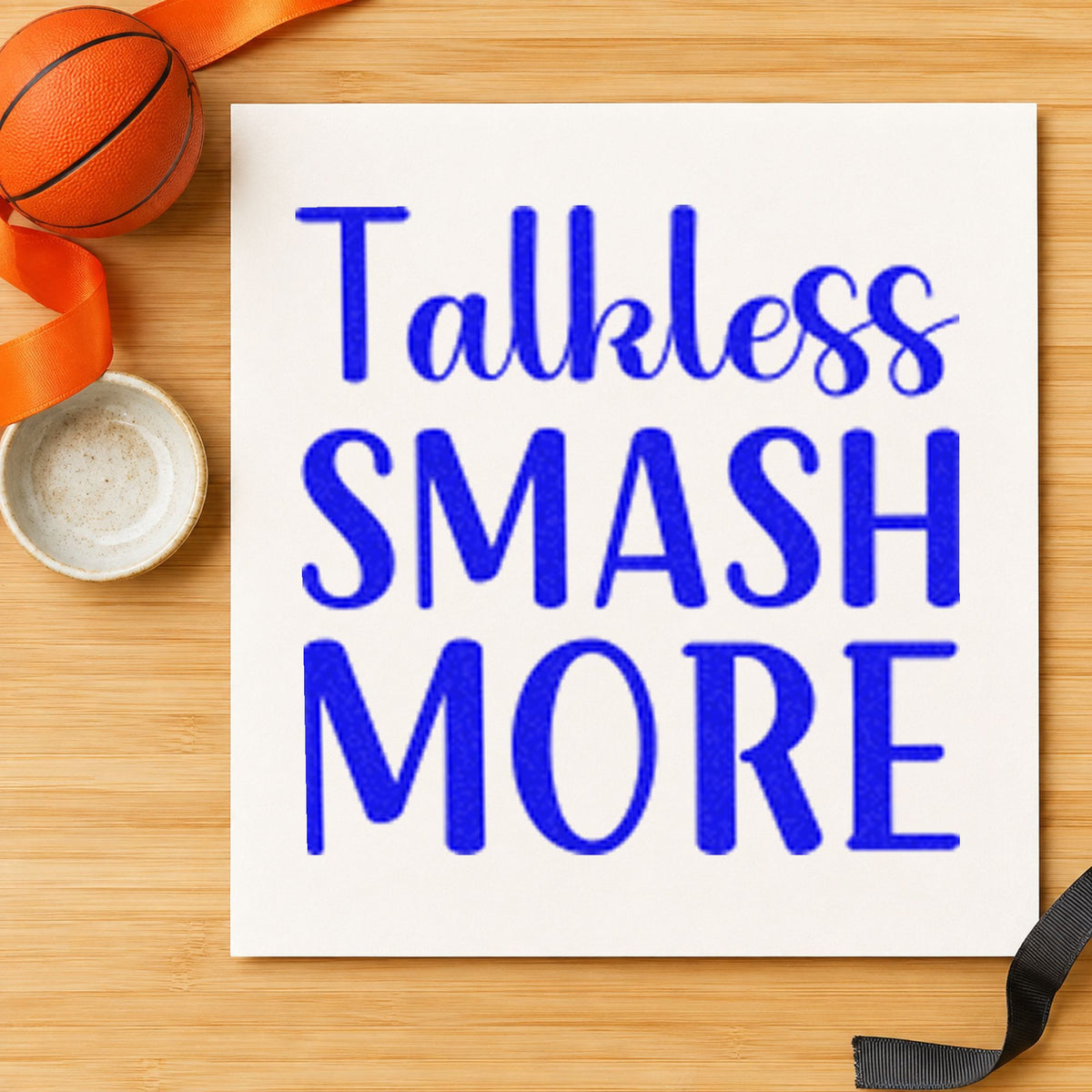 Talk Less Smash More craft stamp imprinted in blue ink on paper, a design suited to framed practice net.