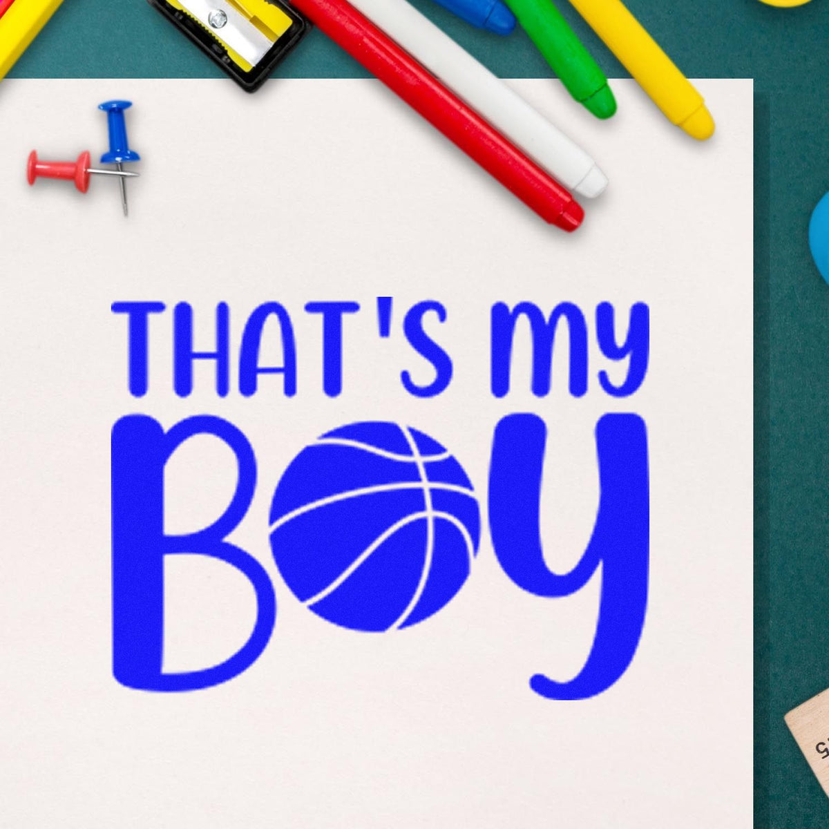 Blue custom stamp and seal reading Thats My Boy with basketball O, surrounded by red, green, yellow and blue markers.