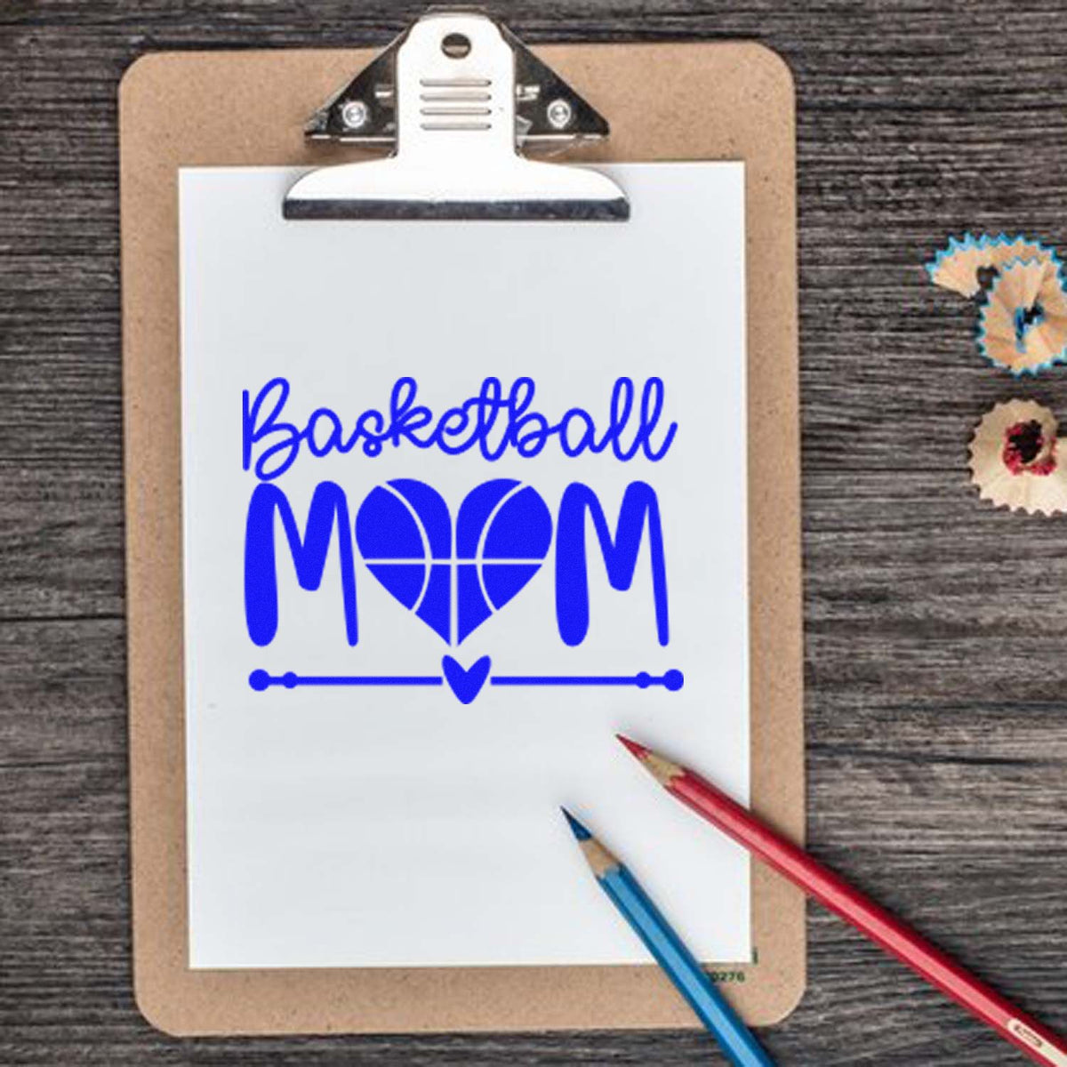 Blue Basketball Mom stamp and seal on white paper clipboard, with heart basketball graphic and pencils.
