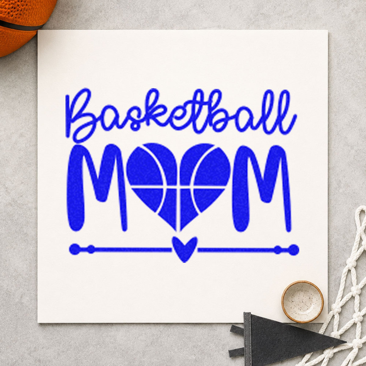 Basketball Mom Heart Letter craft stamp imprinted in blue ink on paper, a design suited to framed kitchen island.