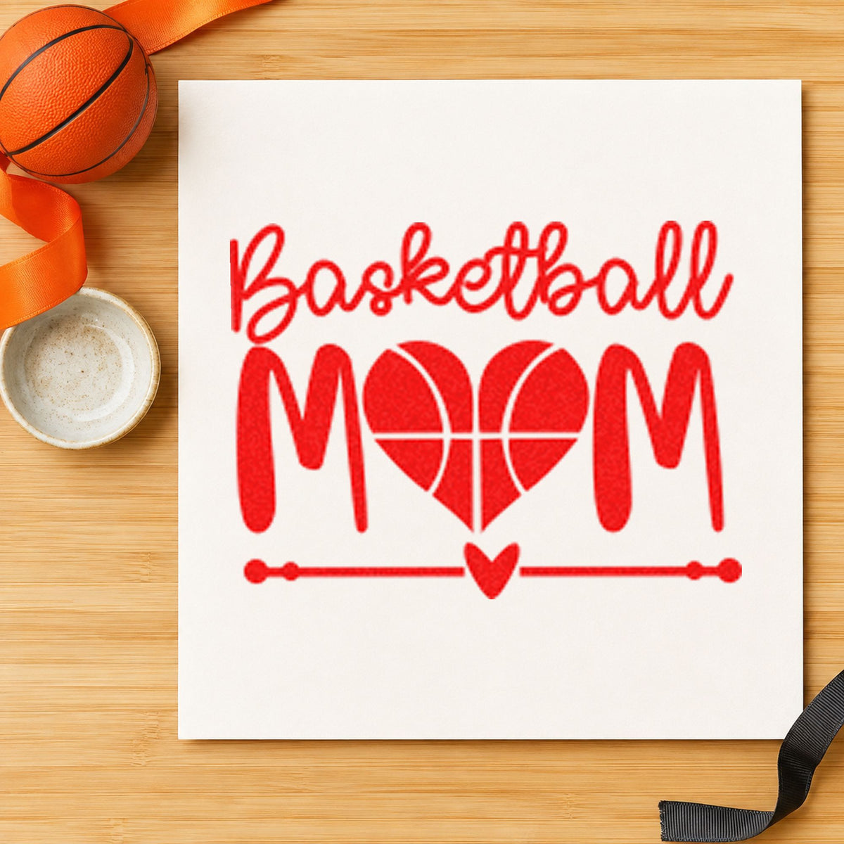 Basketball Mom Heart Letter rubber stamp shown in red ink, stamped for projects such as bin serving labels.