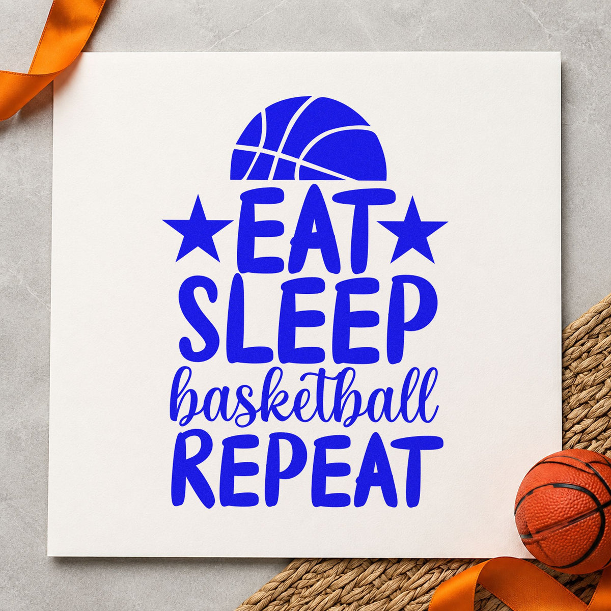 Eat Sleep Basketball Repeat craft stamp in blue ink on cardstock, an easy option for duffel panel printing.