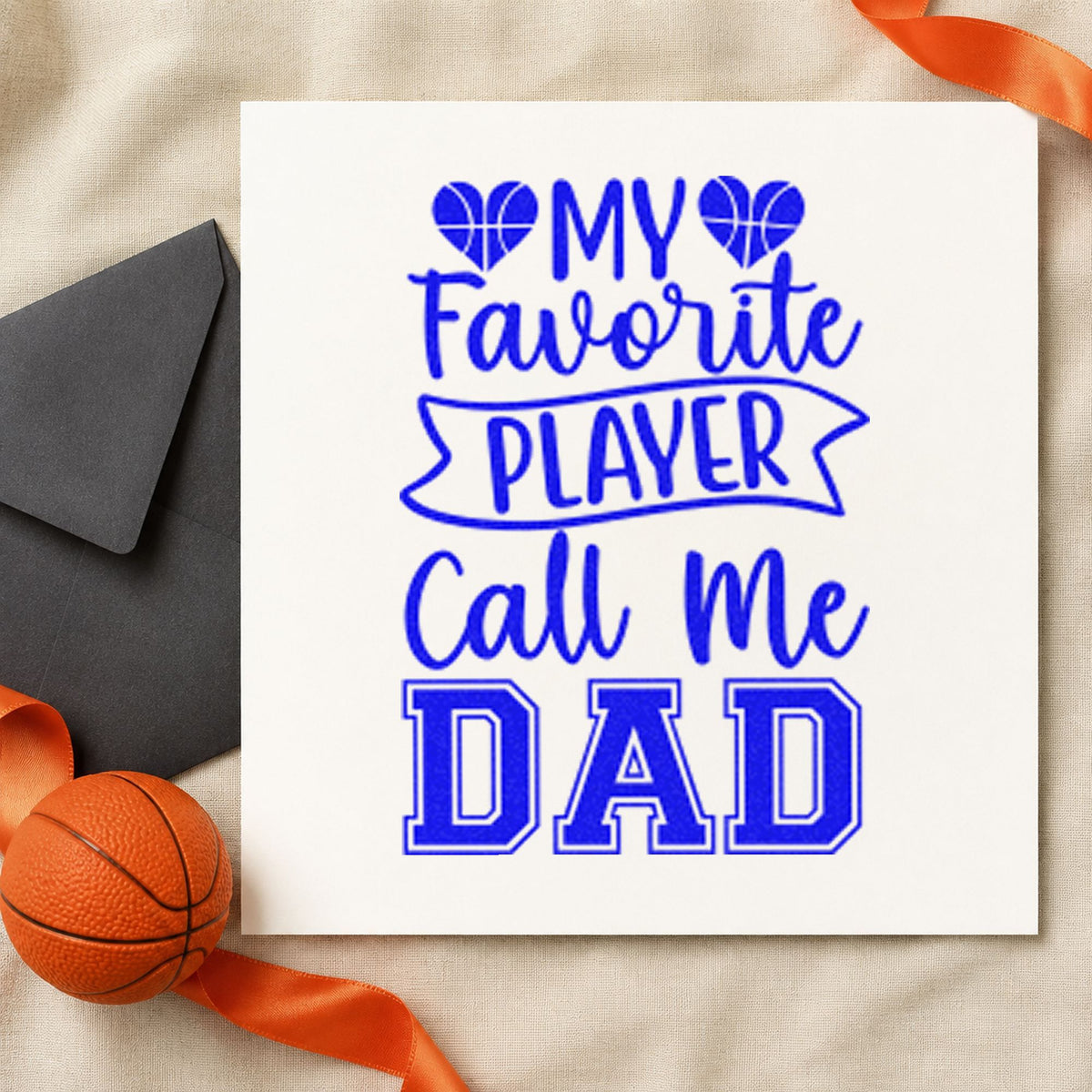 Favorite Player Dad Hearts craft stamp in blue ink on cardstock, an easy option for desk mat printing.