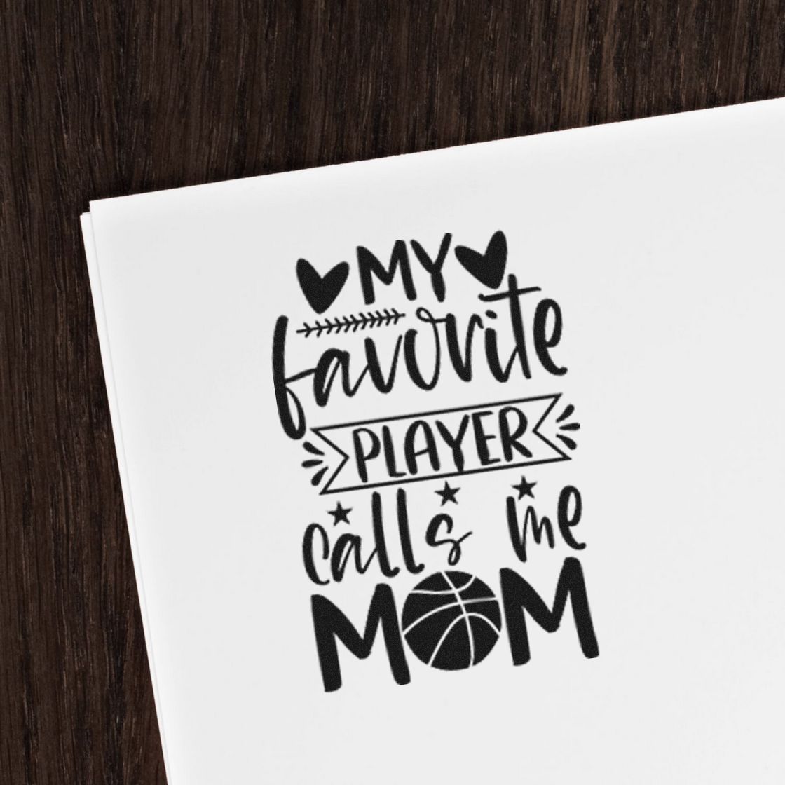 Black custom stamp/seal design reading My favorite player calls me mom with hearts and basketball on white paper.