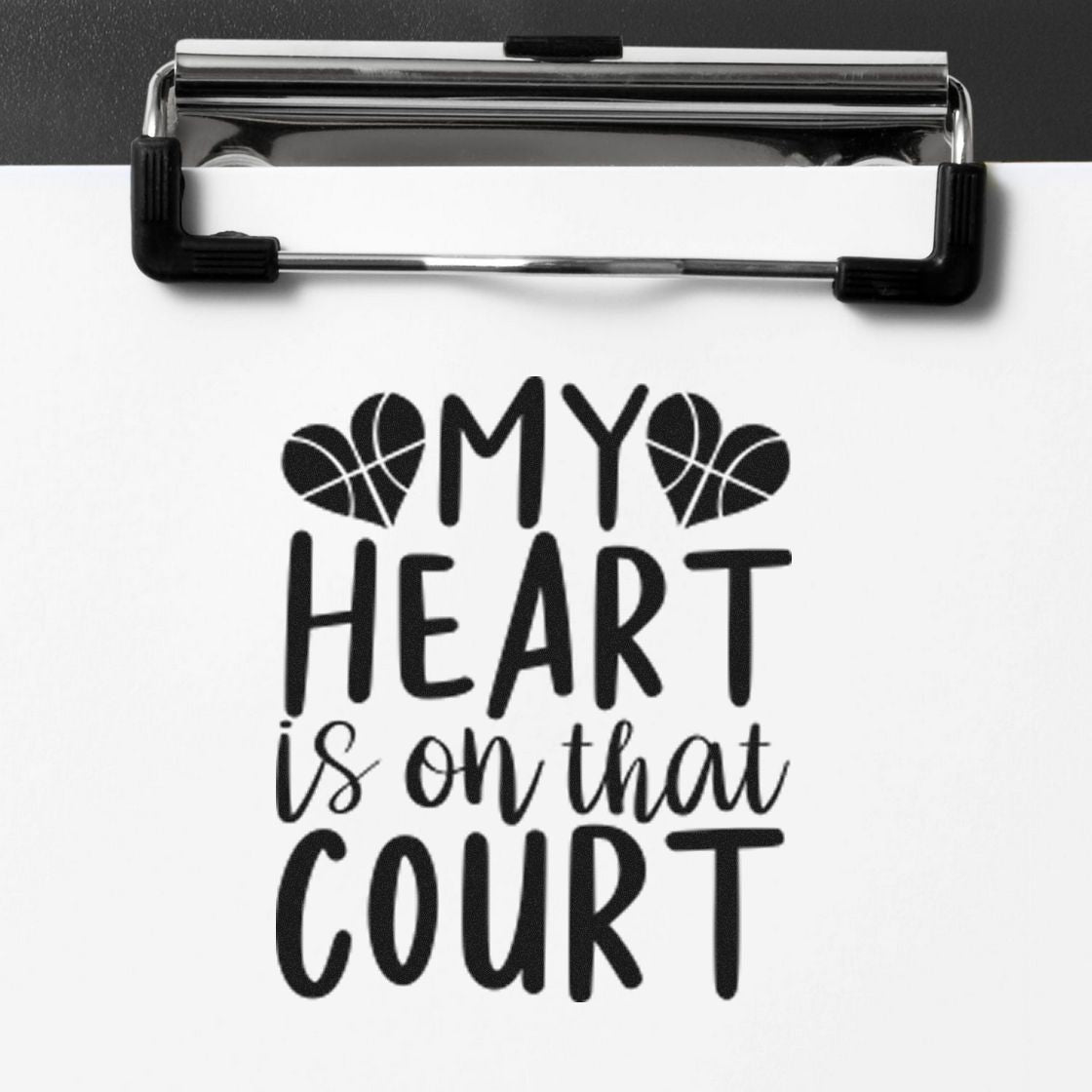 Black custom stamp on white paper reads My heart is on that court with basketball heart icons on a silver clipboard.