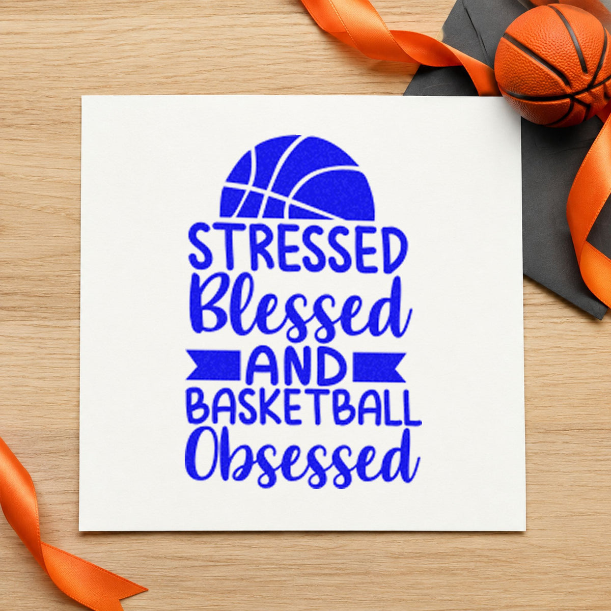 Stressed Blessed Basketball Obsessed craft stamp in blue ink on cardstock, an easy option for binder cover printing.