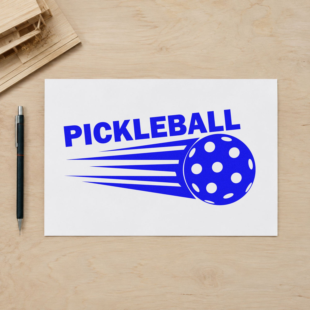 Pickleball Speeding Ball Graphic craft stamp imprinted in blue ink on paper, a design suited to framed court gate.