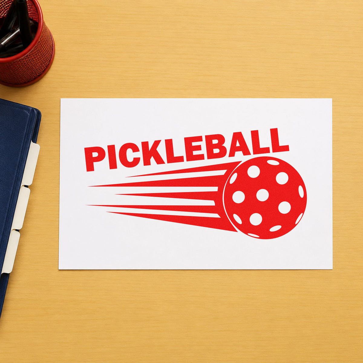 Pickleball Speeding Ball Graphic rubber stamp shown in red ink, stamped for projects such as bin loaner labels.