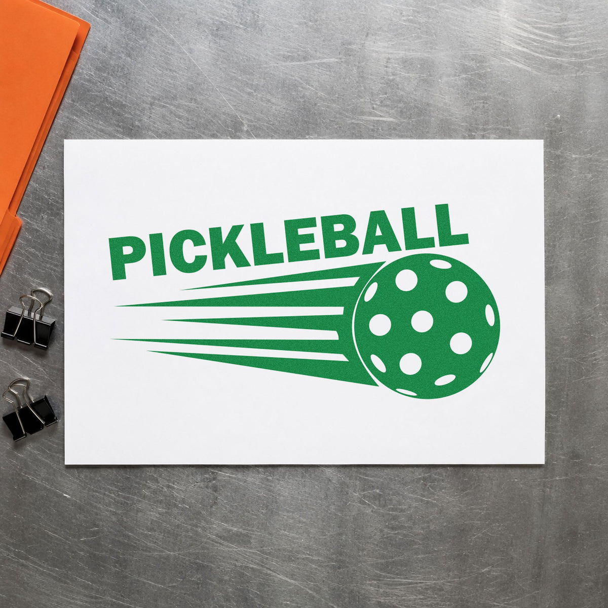 Pickleball Speeding Ball Graphic craft stamp imprint in green ink on a handmade project, one idea being rule basics cards.